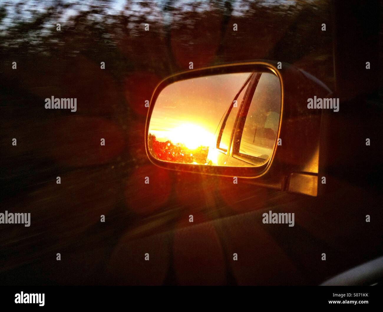 Sunset reflects in car mirror - Smartphone Captured Stock Image