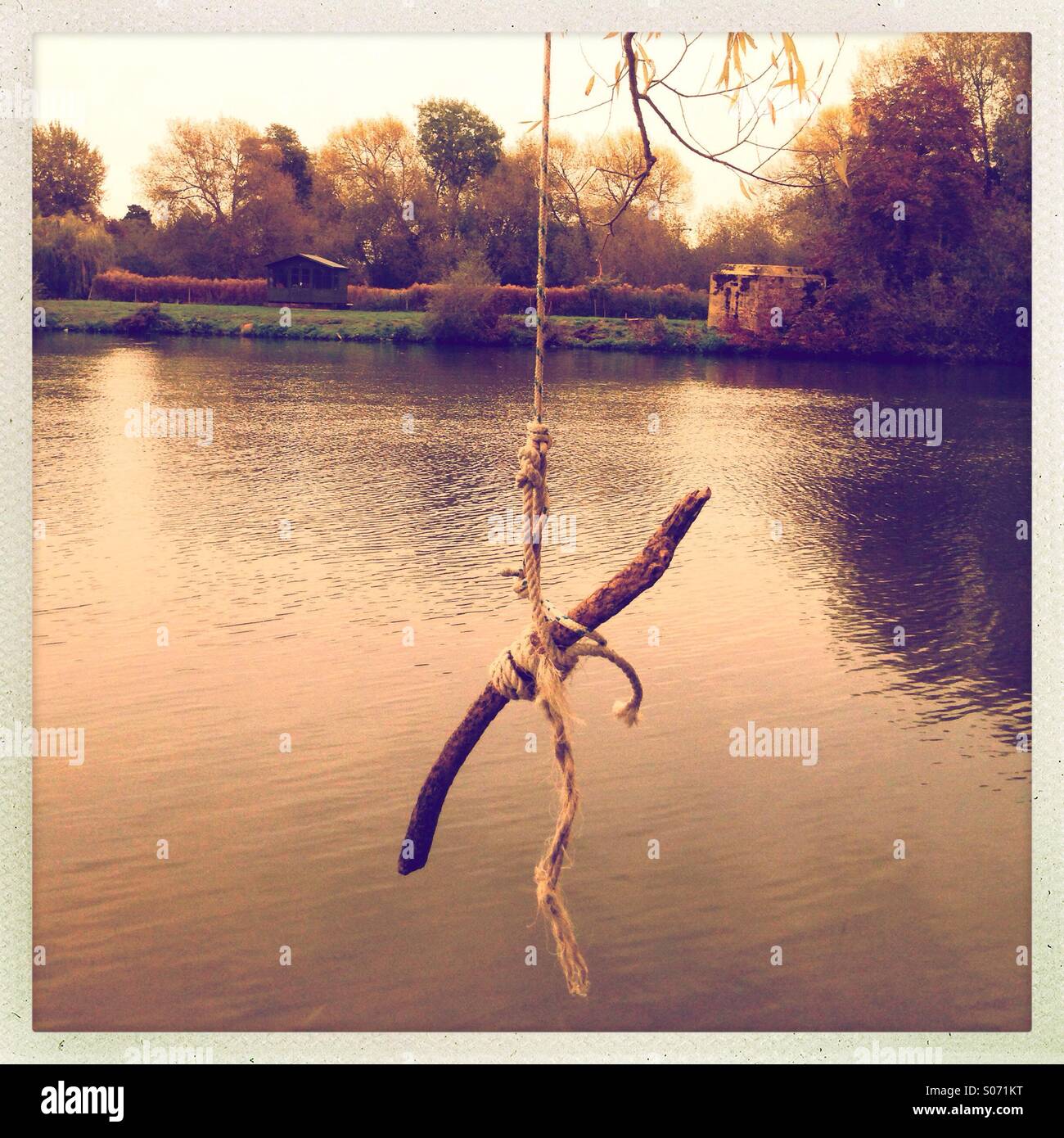 Rope swing, jump in Stock Photo Alamy