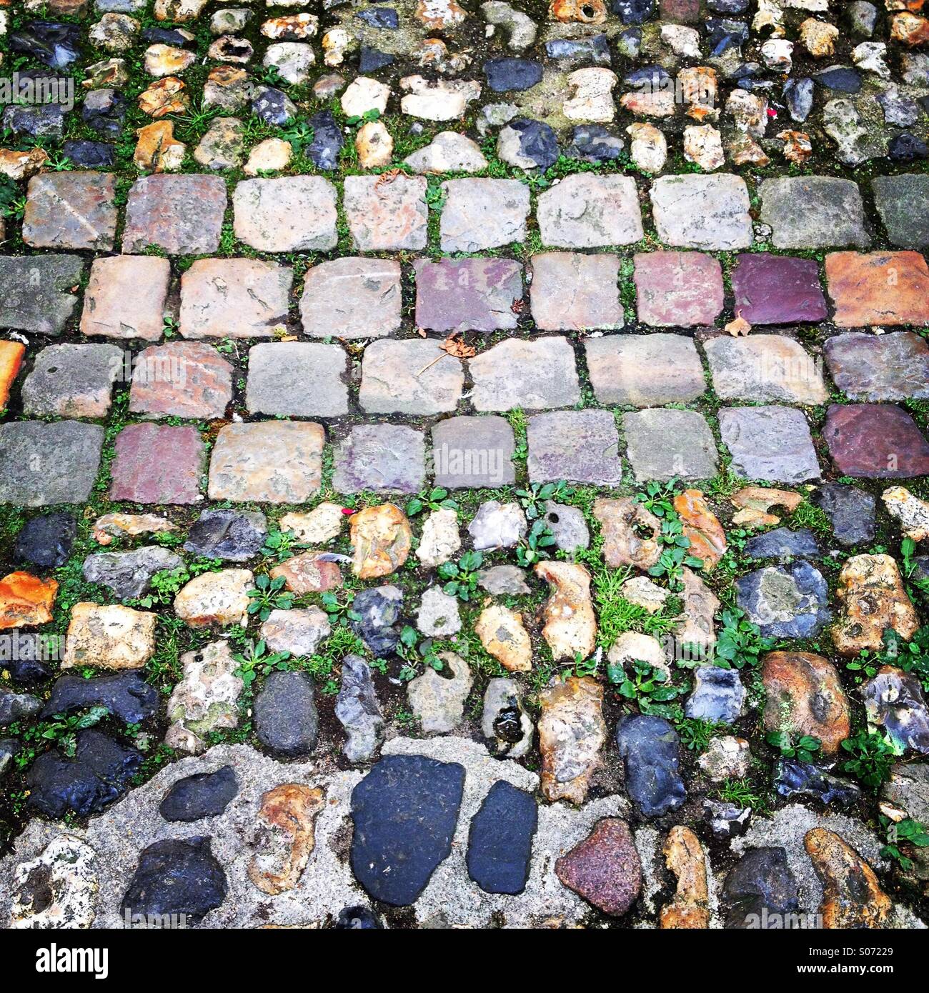 Old cobblestones full frame background texture. Mobile phone photo with some phone or tablet post processing. - Smartphone Captured Stock Image