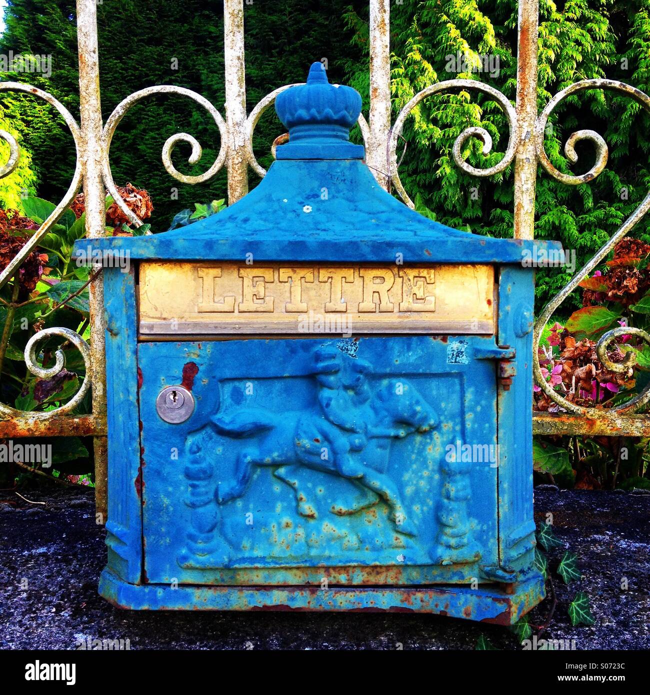 Art deco letterbox on railings outside a village house in Normandy, France. Mobile phone photo with some phone or tablet post processing. - Smartphone Captured Stock Image