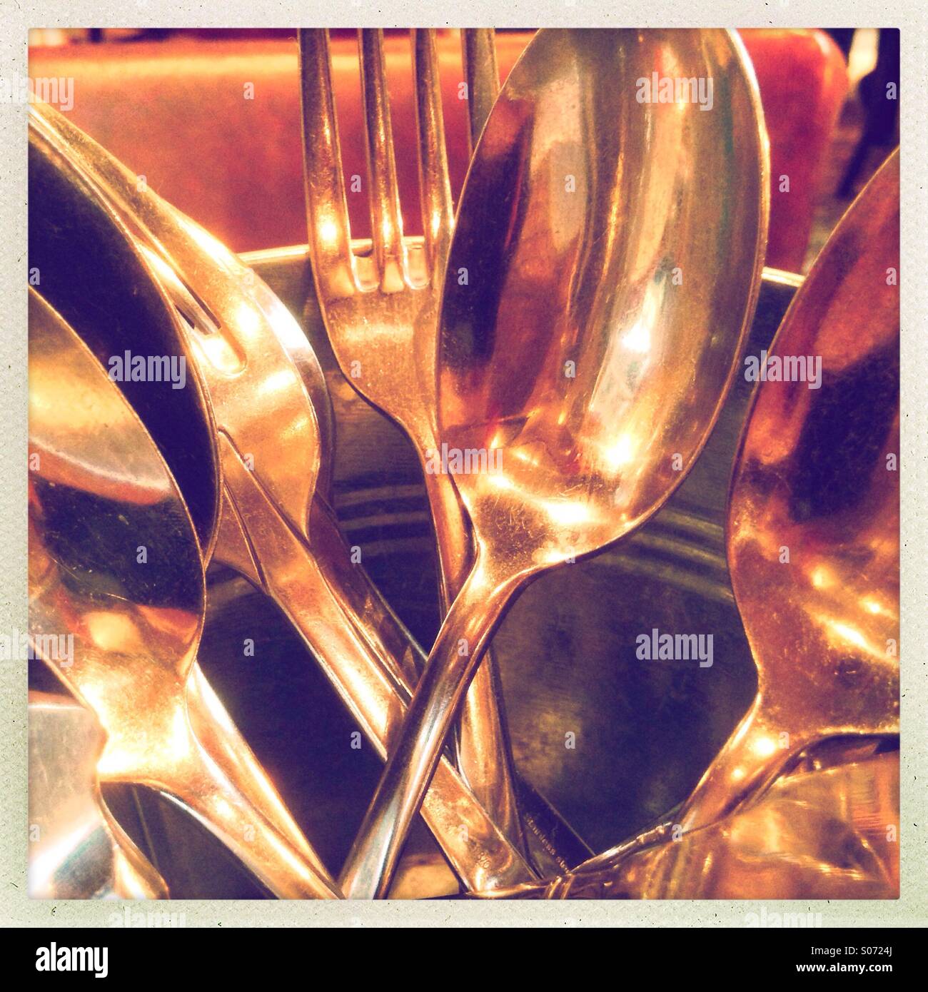 Cutlery in metal bucket Stock Photo Alamy