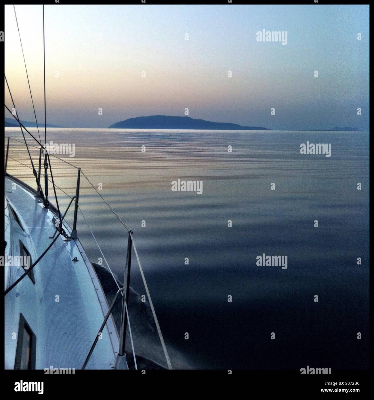 Sailing yacht on the sunset Stock Photo