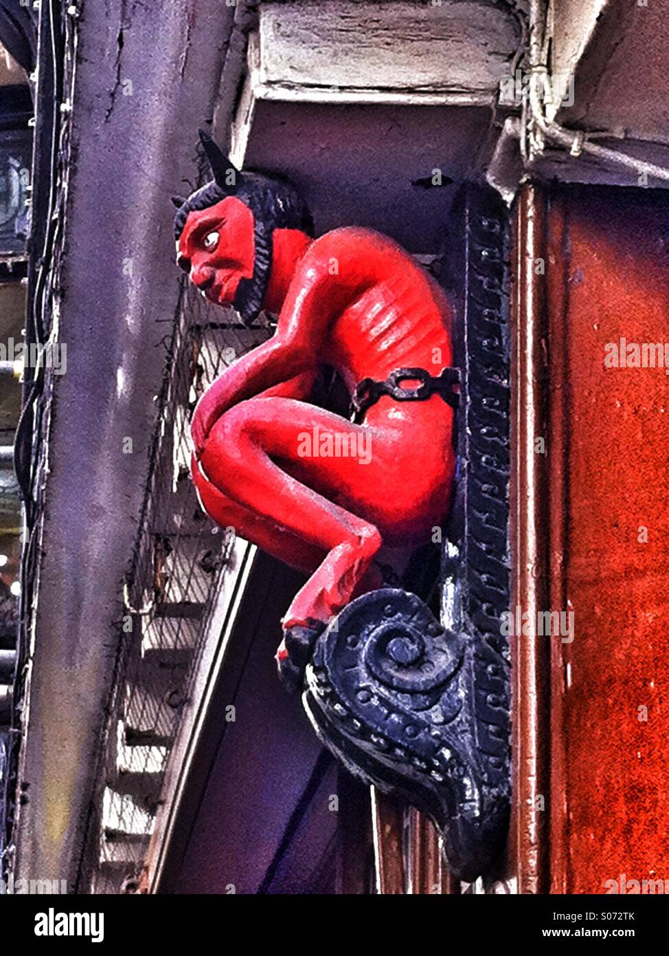 Red Devil figure Stonegate York North Yorkshire England UK - Smartphone Captured Stock Image