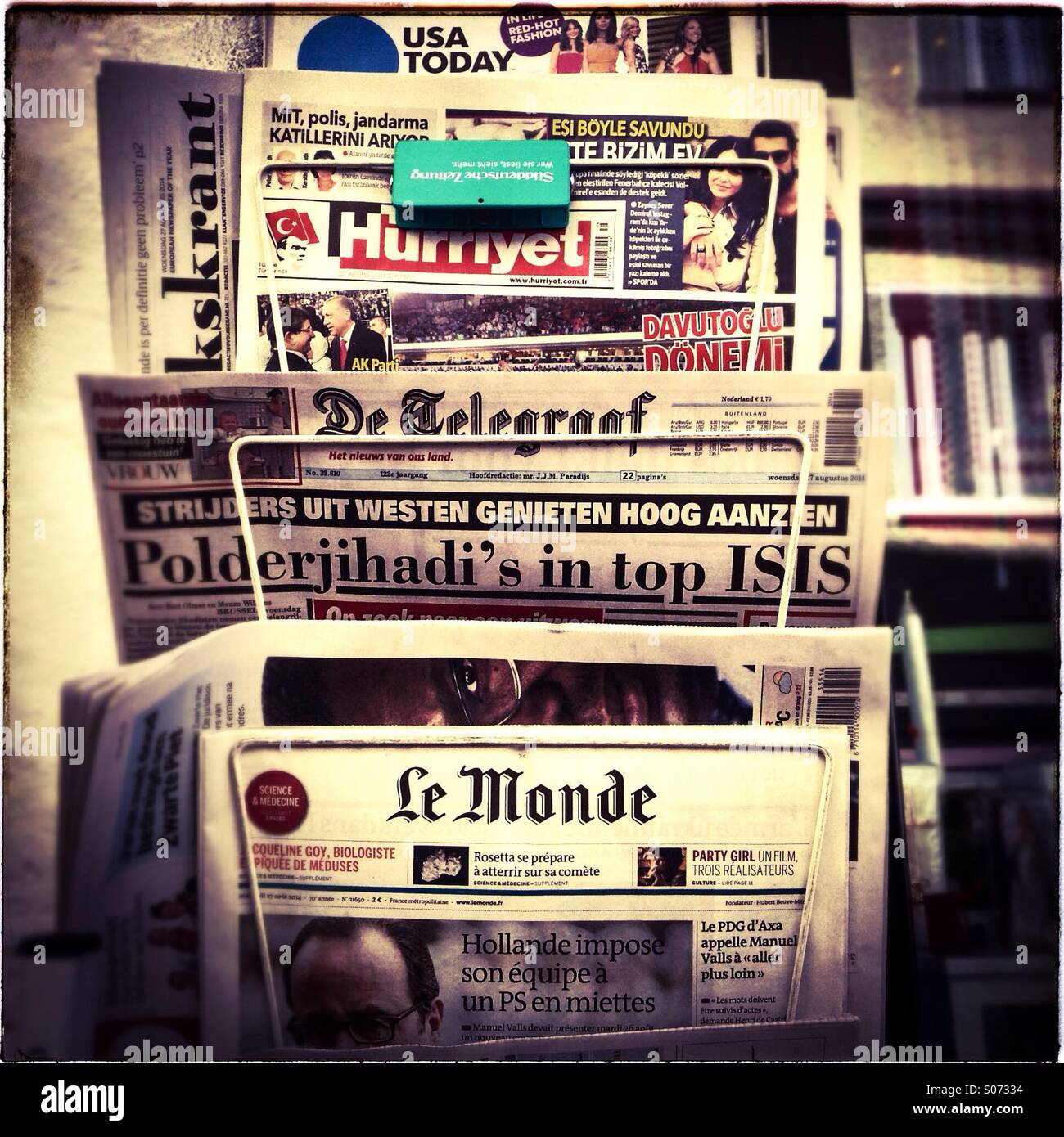 World press international and foreign newspapers for sale on rack city centre - Smartphone Captured Stock Image