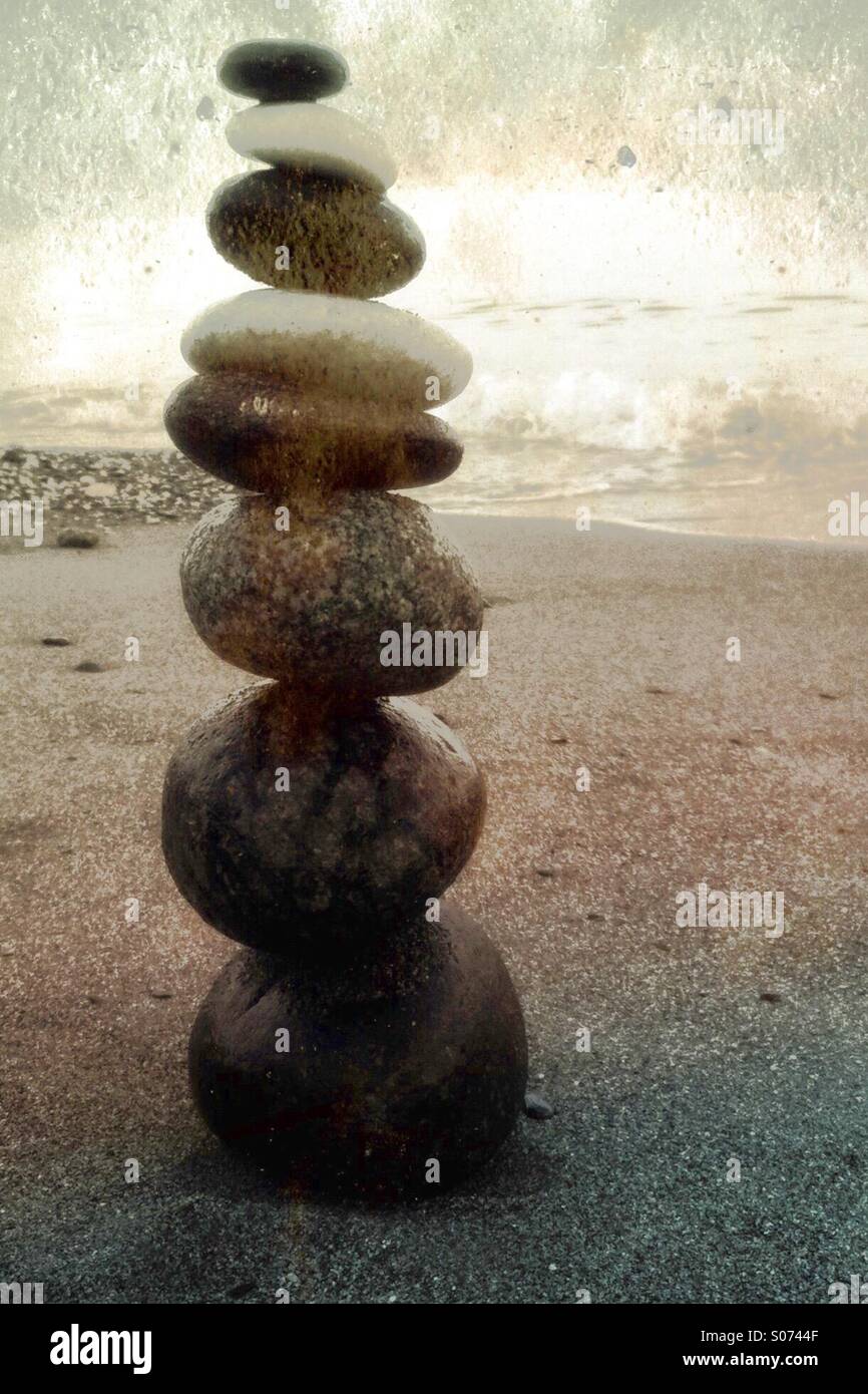 A pile of balanced Peebles on a beach - Smartphone Captured Stock Image