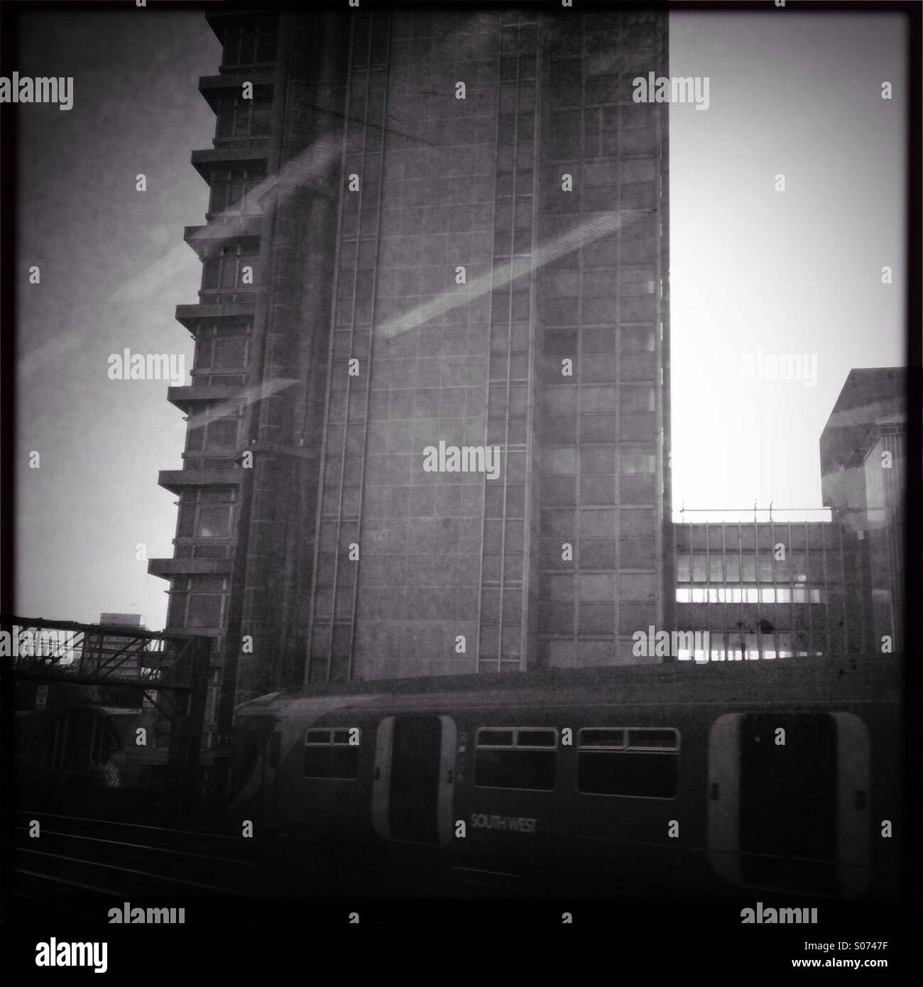 Apartment building and southwest train in black and white Stock Photo