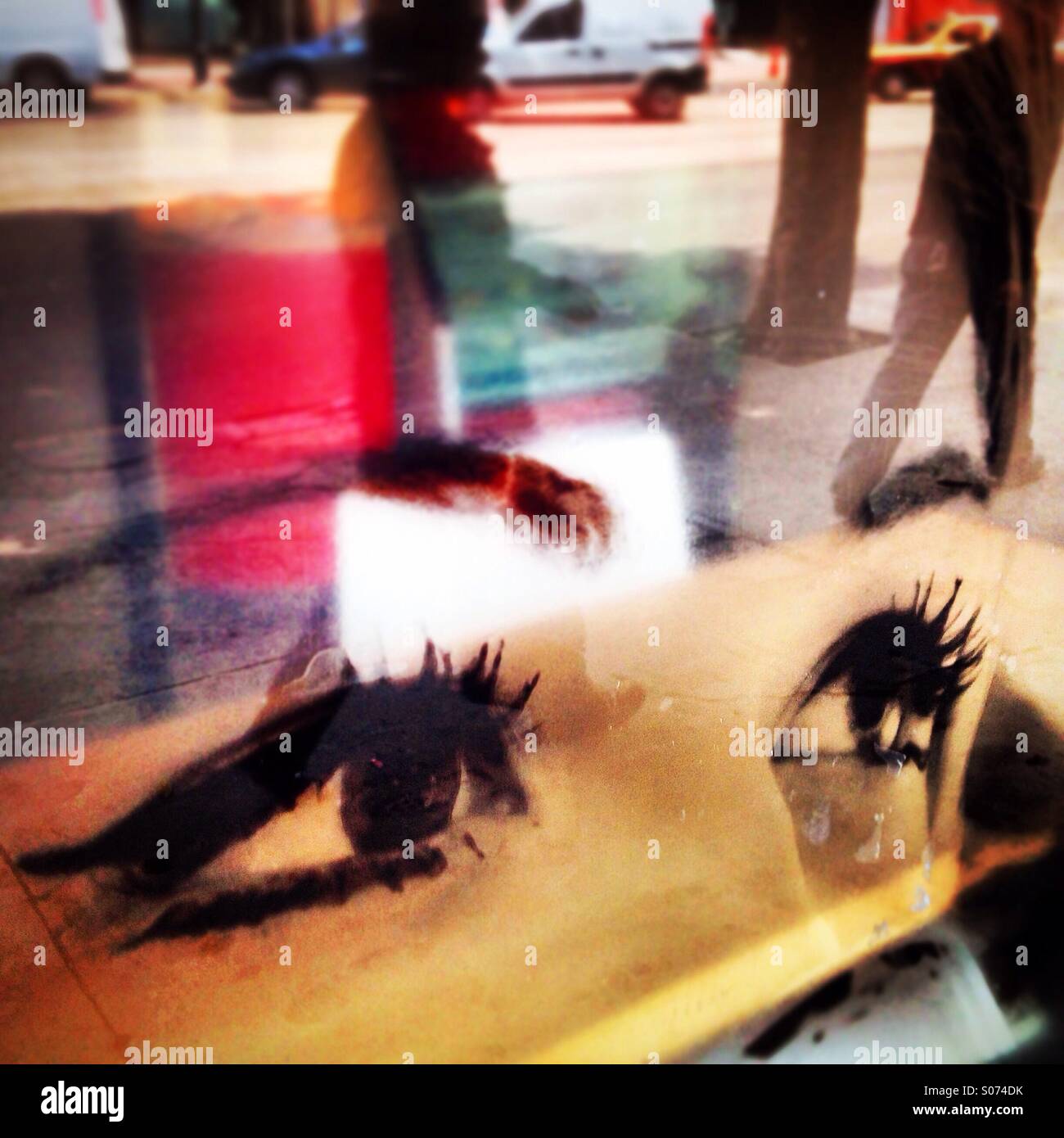 Reflection of a street of Mexico City in a window decorated with a female eyes in Insurgentes , Colonia Roma, Mexico City, Mexico Stock Photo