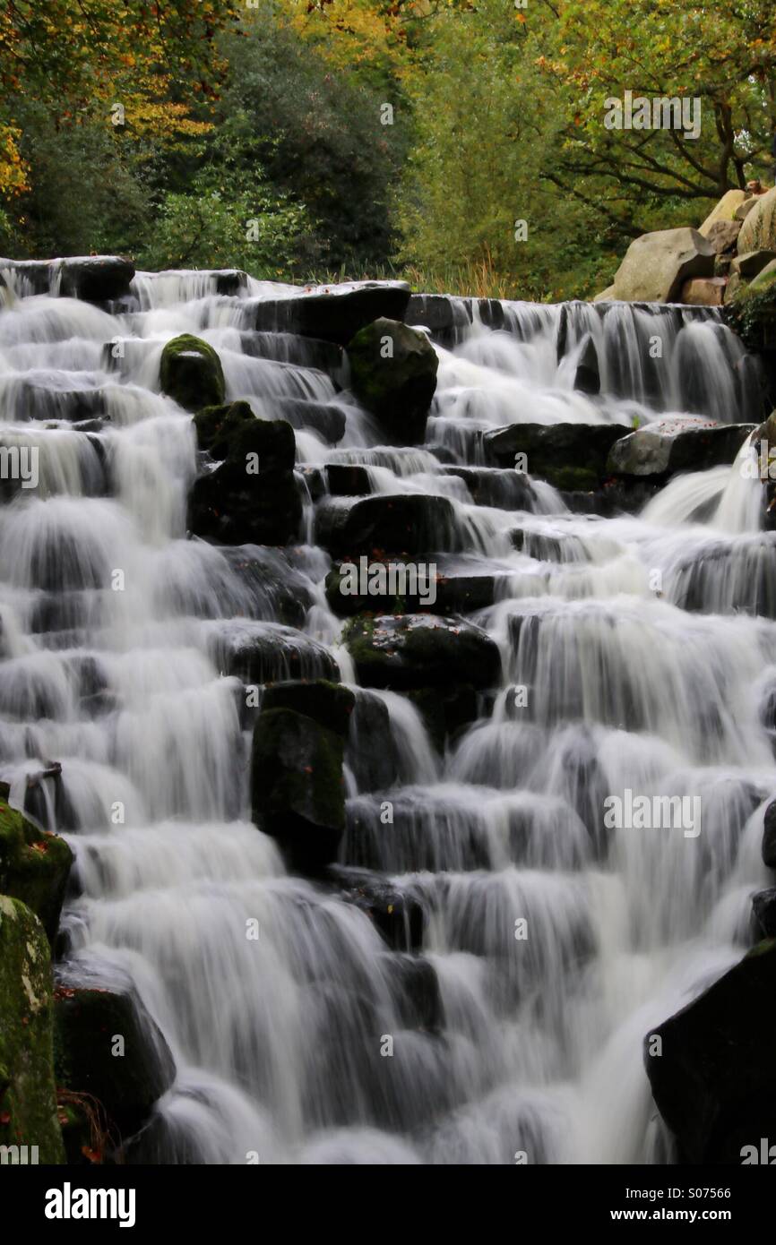 A waterfall taken using a long exposure with softened water. Stock Photo