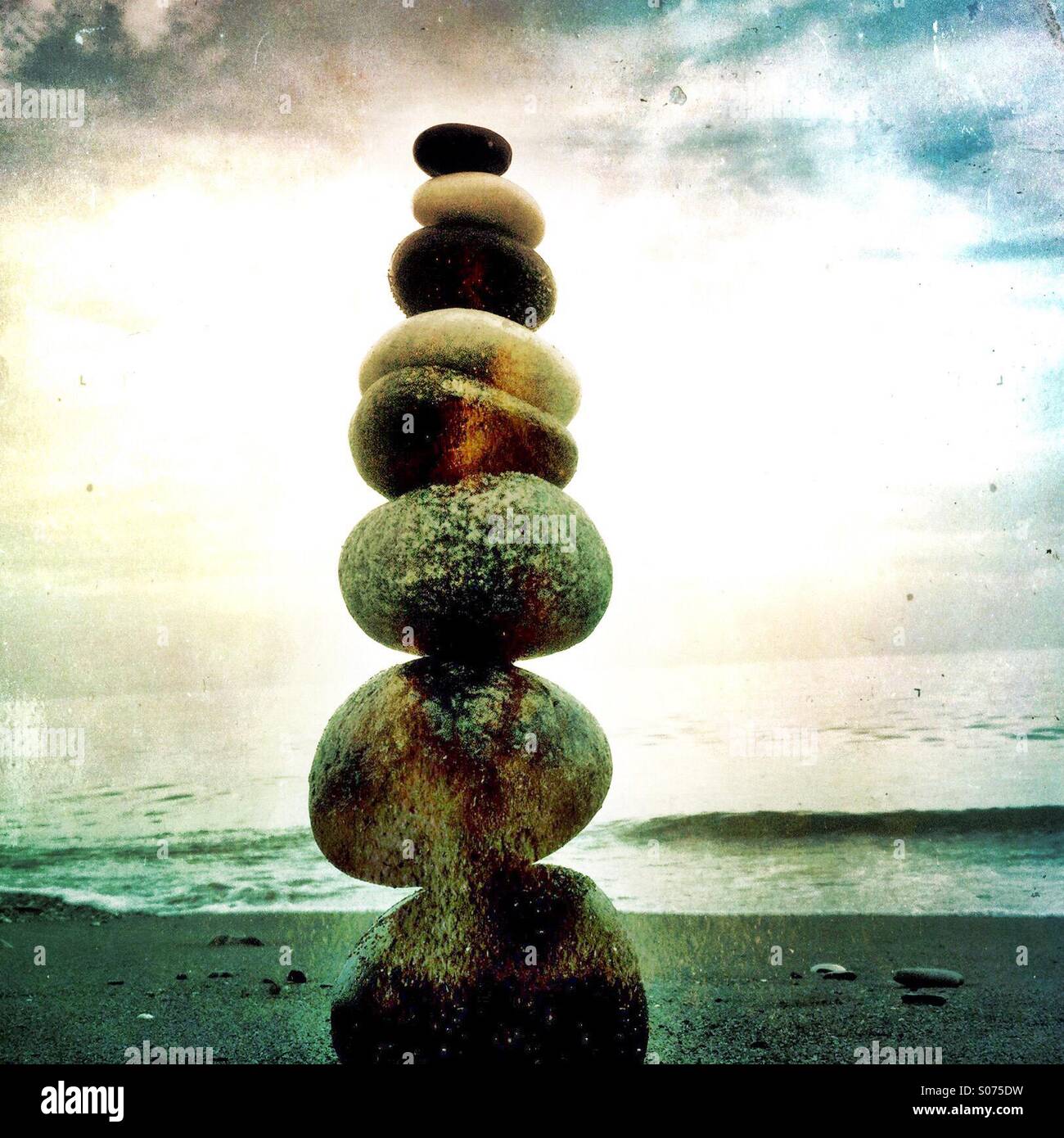 A pile of balanced stones on a beach - Smartphone Captured Stock Image