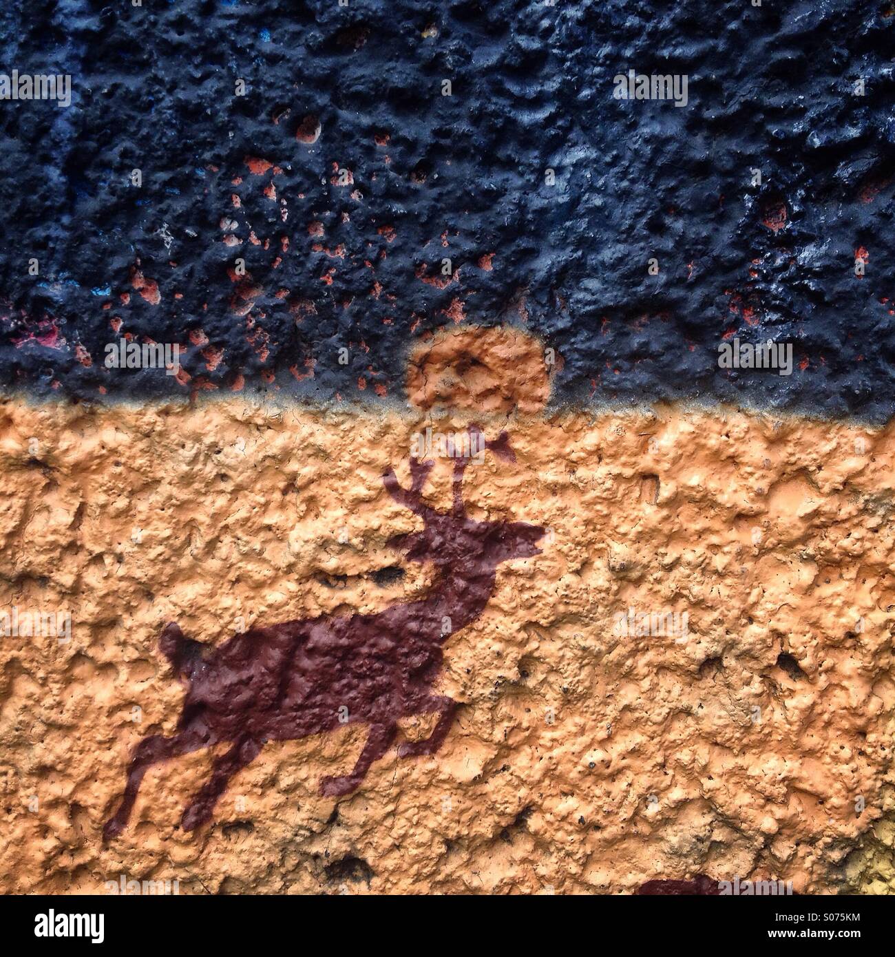 A deer painted in an brown and blue wall in Colonia Escandon, Mexico City, Mexico - Smartphone Captured Stock Image