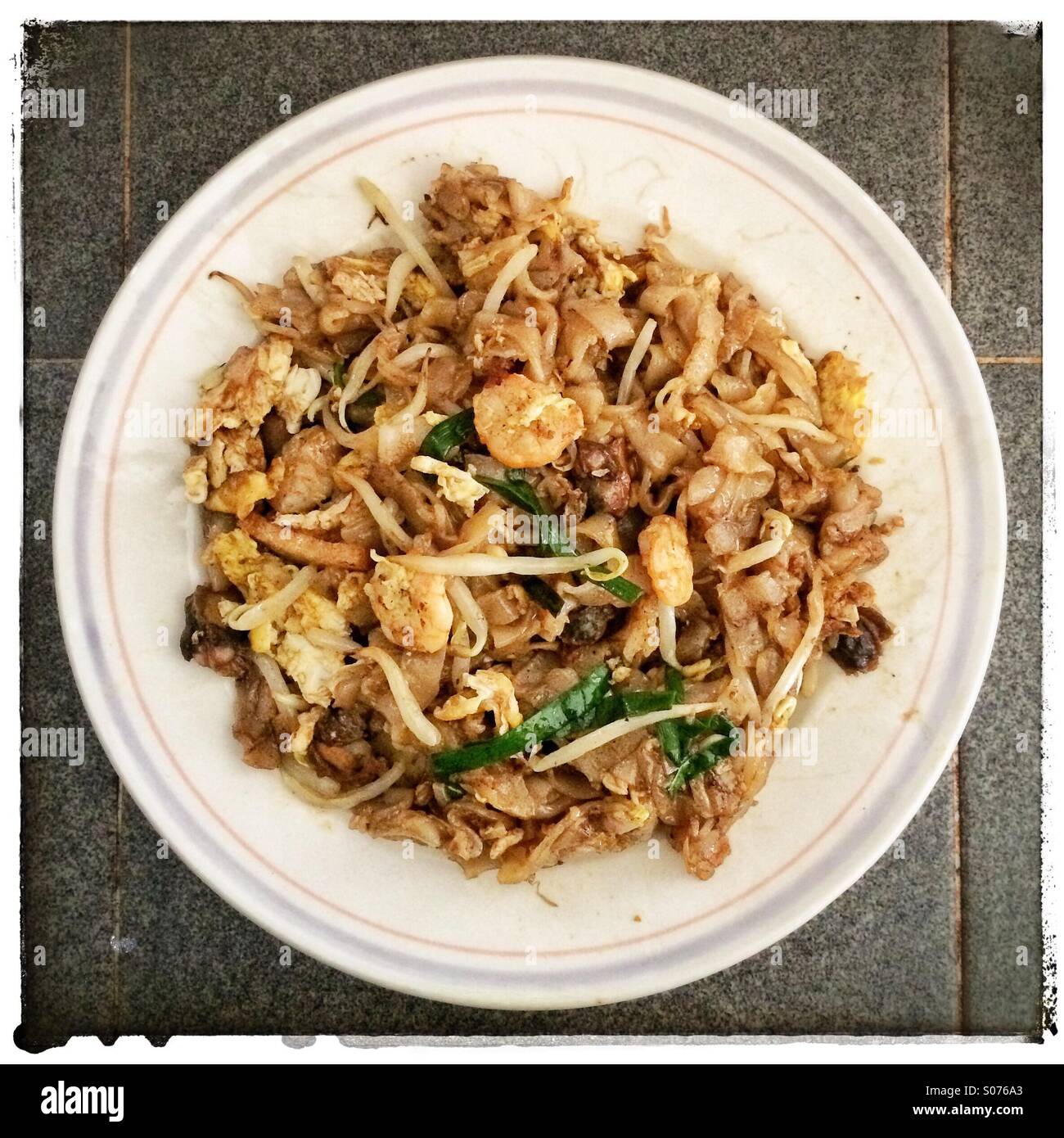 Malaysian fried flat rice noodles Char Kway Teow - Smartphone Captured Stock Image