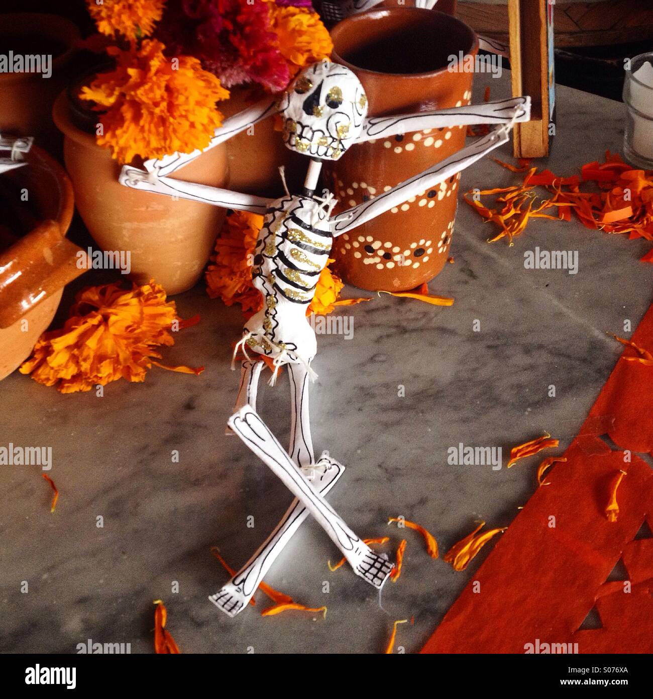 A lounging skeleton decorates an altar for the Day of the Dead celebration in Toscano restaurant, Colonia Roma, Mexico City, Mexico Stock Photo