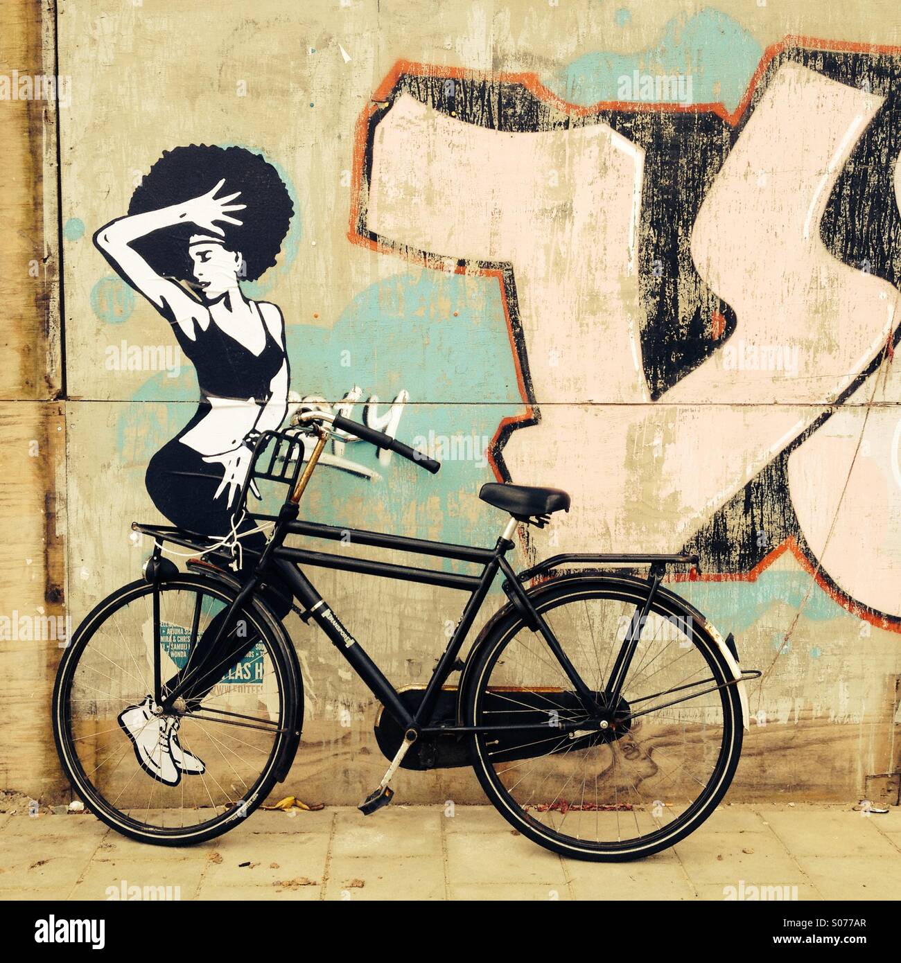 Parked bike and street art Stock Photo - Alamy