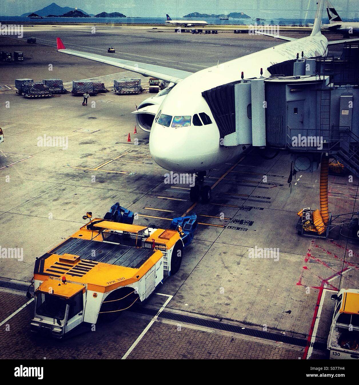 Plane on the tarmac of the international hong kong airport - Smartphone Captured Stock Image