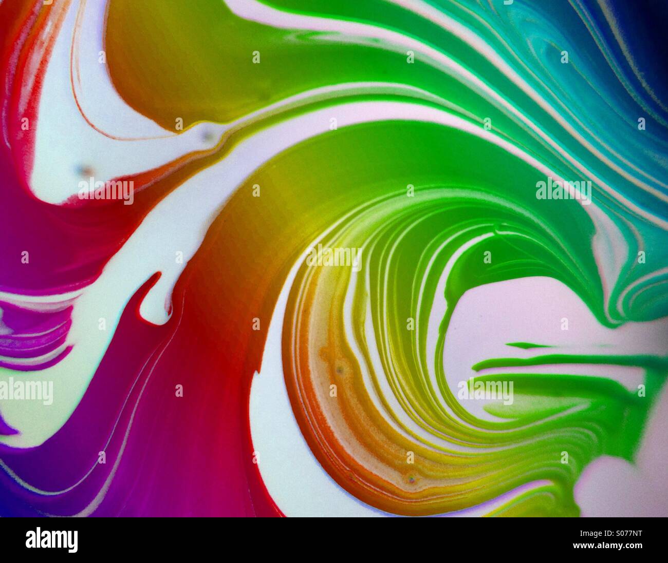 Paint mixing together Stock Photo Alamy
