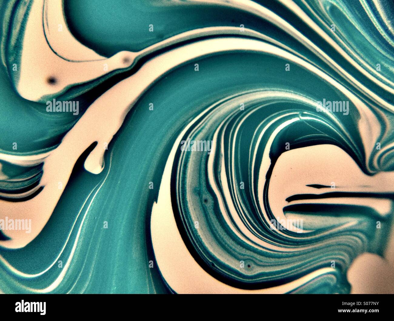 Paint mixing together Stock Photo - Alamy