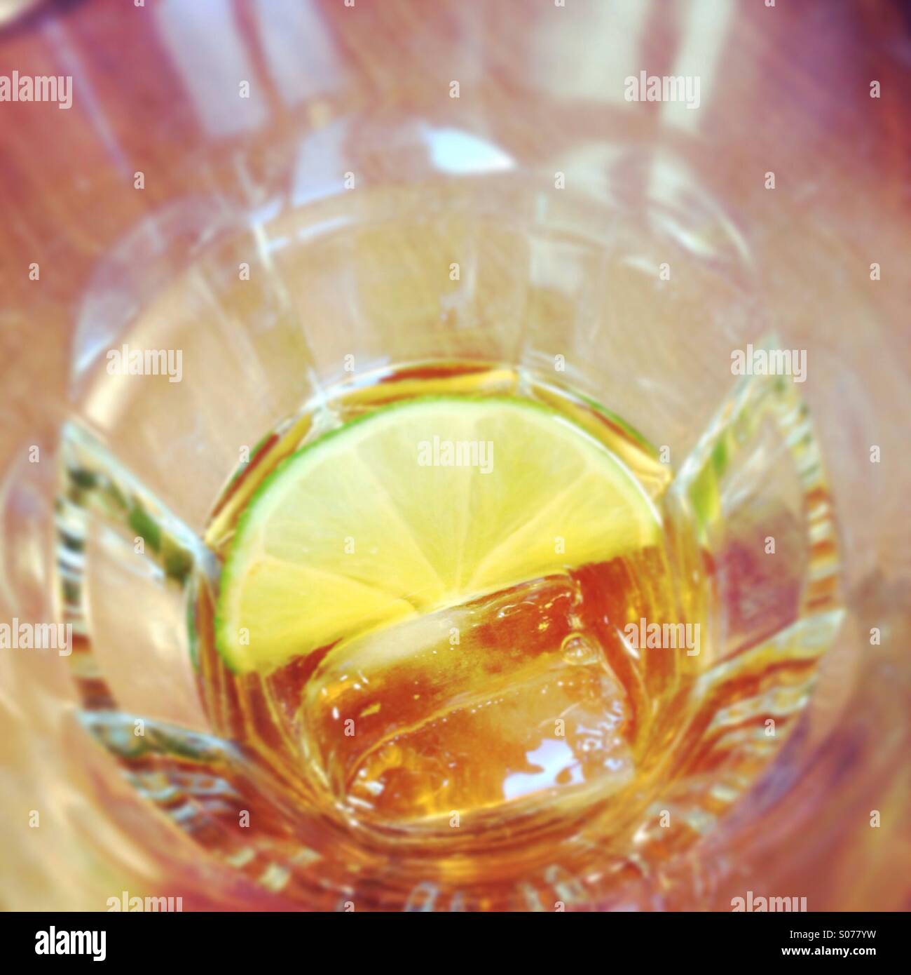 Liquor in glass with lemon Stock Photo Alamy