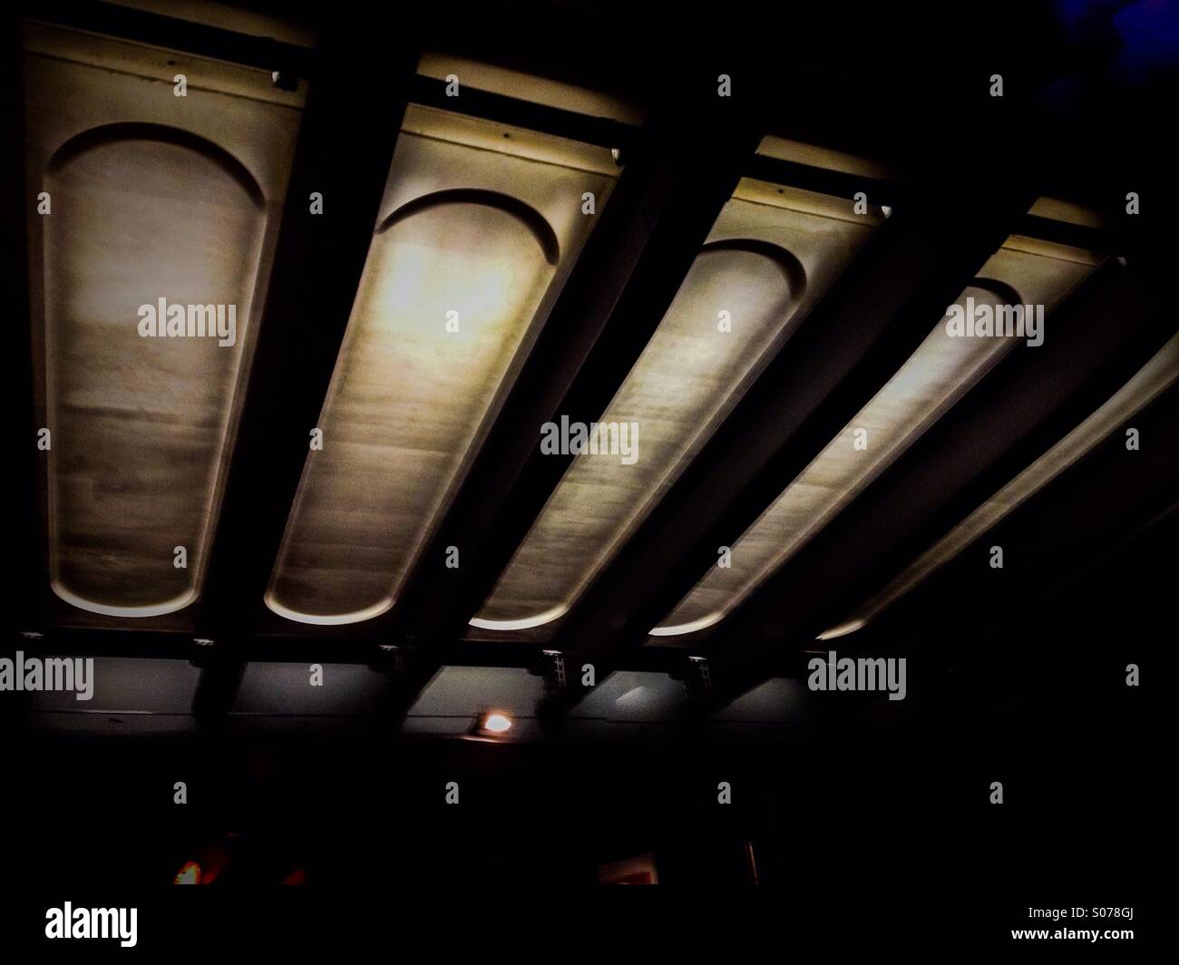 Underside of a rail bridge at night - Smartphone Captured Stock Image