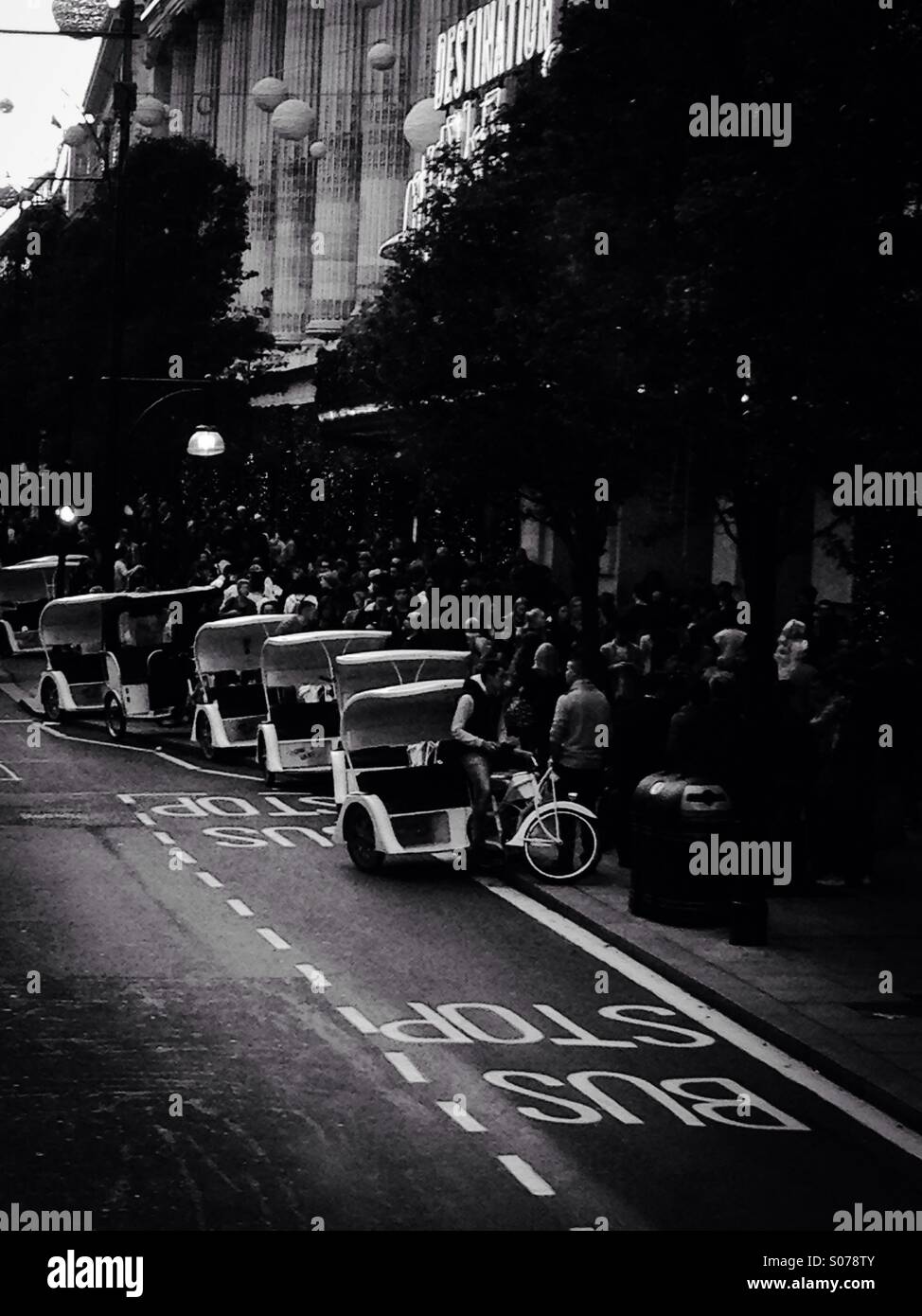 Parked rickshaws in front of Selfridges on Oxford Street, Central London, UK Stock Photo