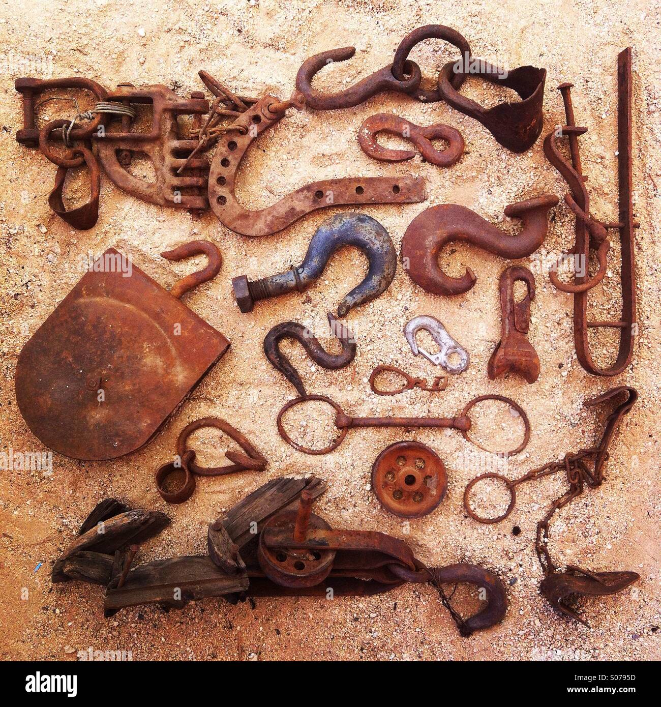 A collection of rusty hooks and pulleys Stock Photo Alamy
