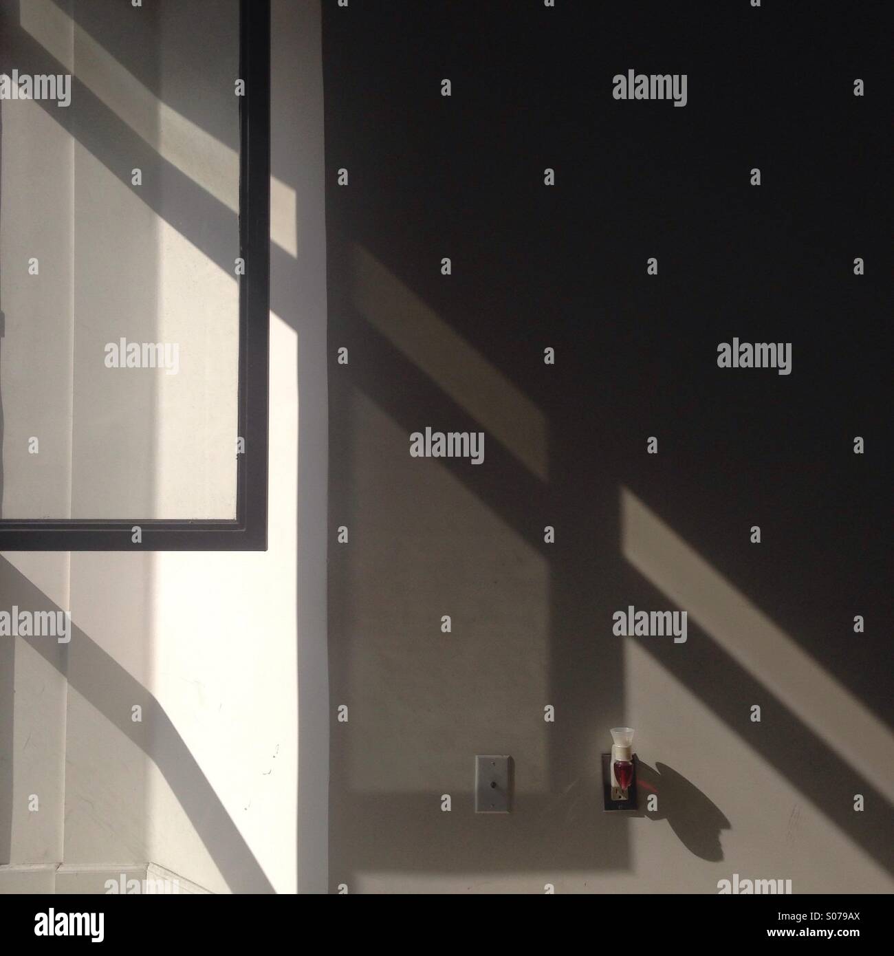 Sun beam patterns and window frame - Smartphone Captured Stock Image