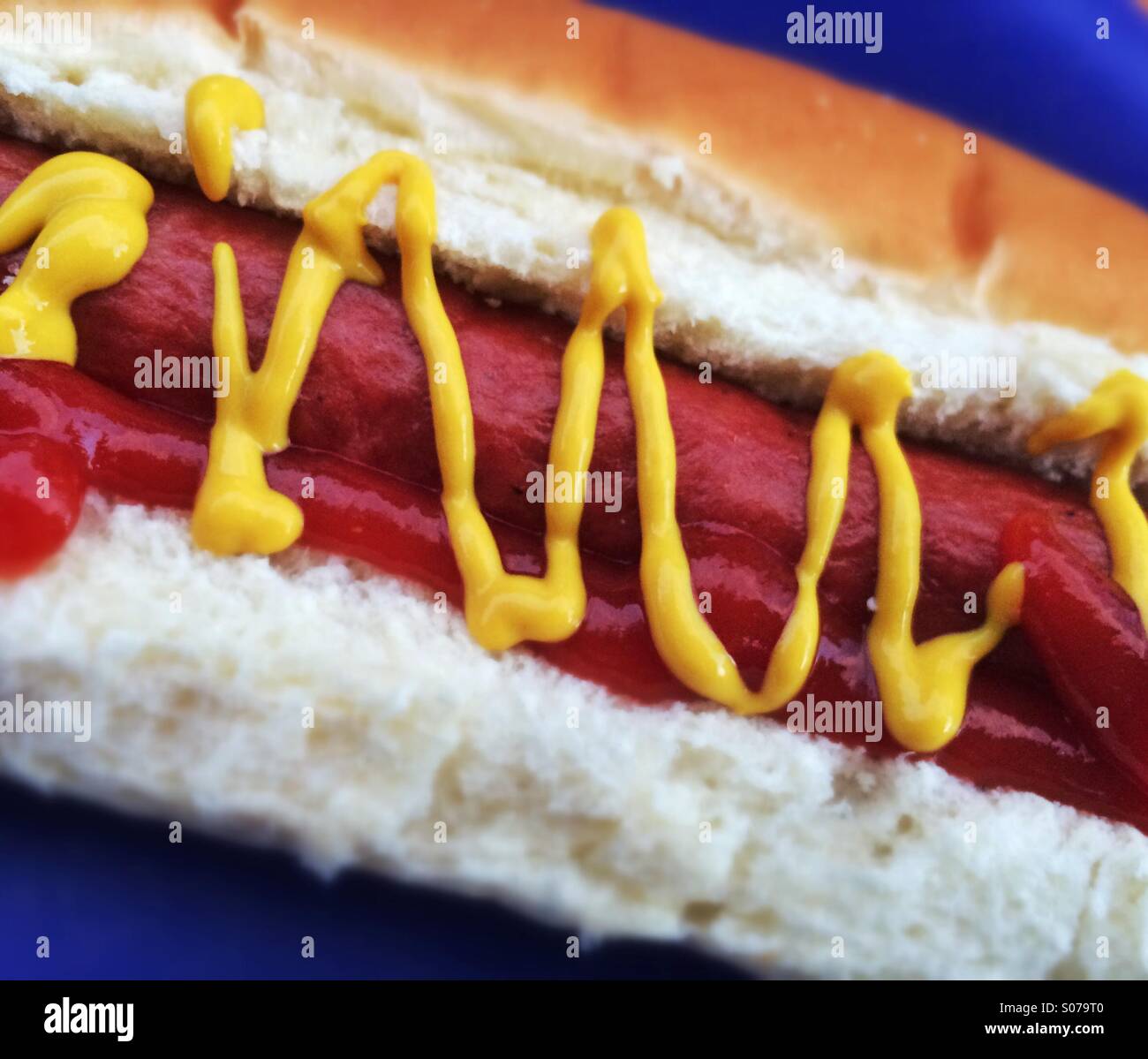 Hot dog in bun with mustard and ketchup - Smartphone Captured Stock Image