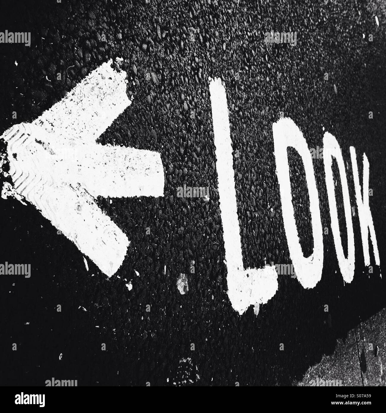 Look with an arrow written on the street. London England UK. - Smartphone Captured Stock Image