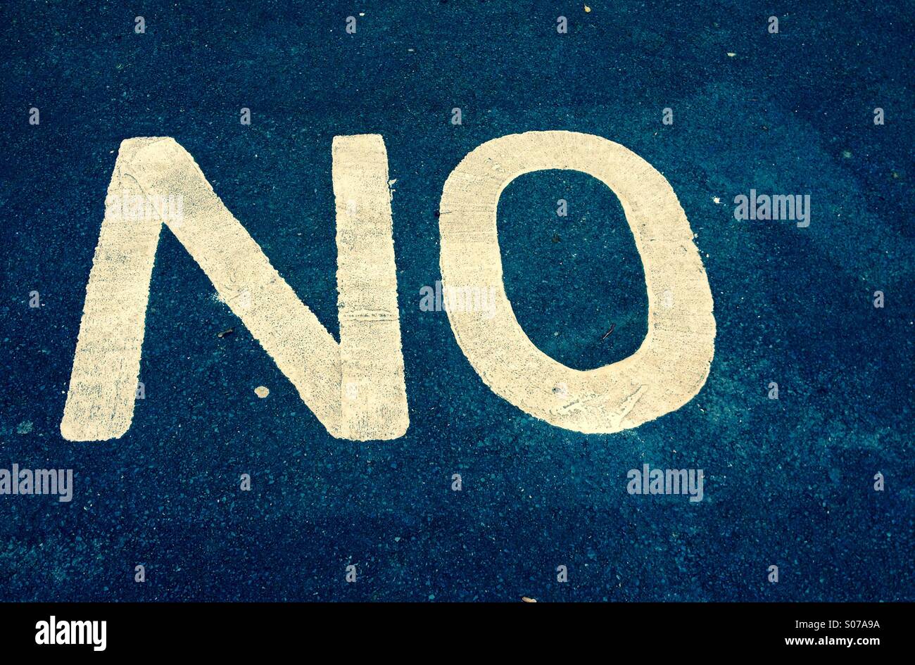 The word no painted on to tarmac - Smartphone Captured Stock Image