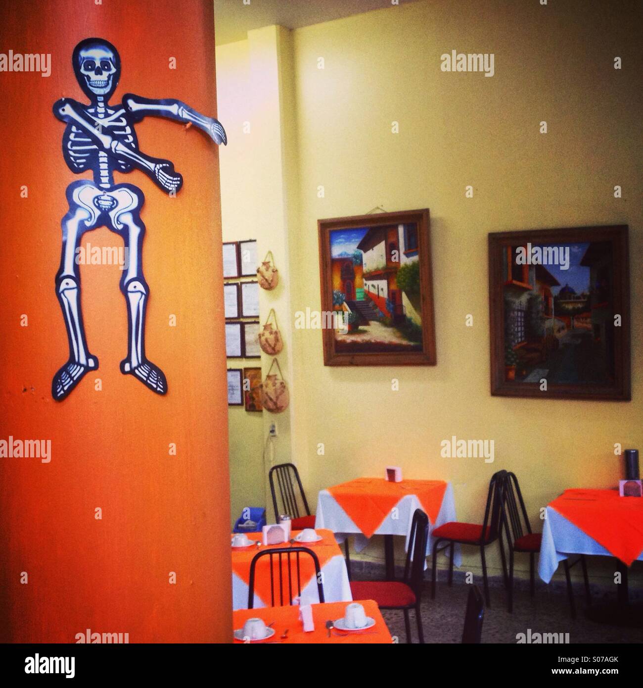 A paper mache skeleton welcomes costumers in the Nueva Tehuana restaurant in Zona Rosa, Mexico City, Mexico Stock Photo