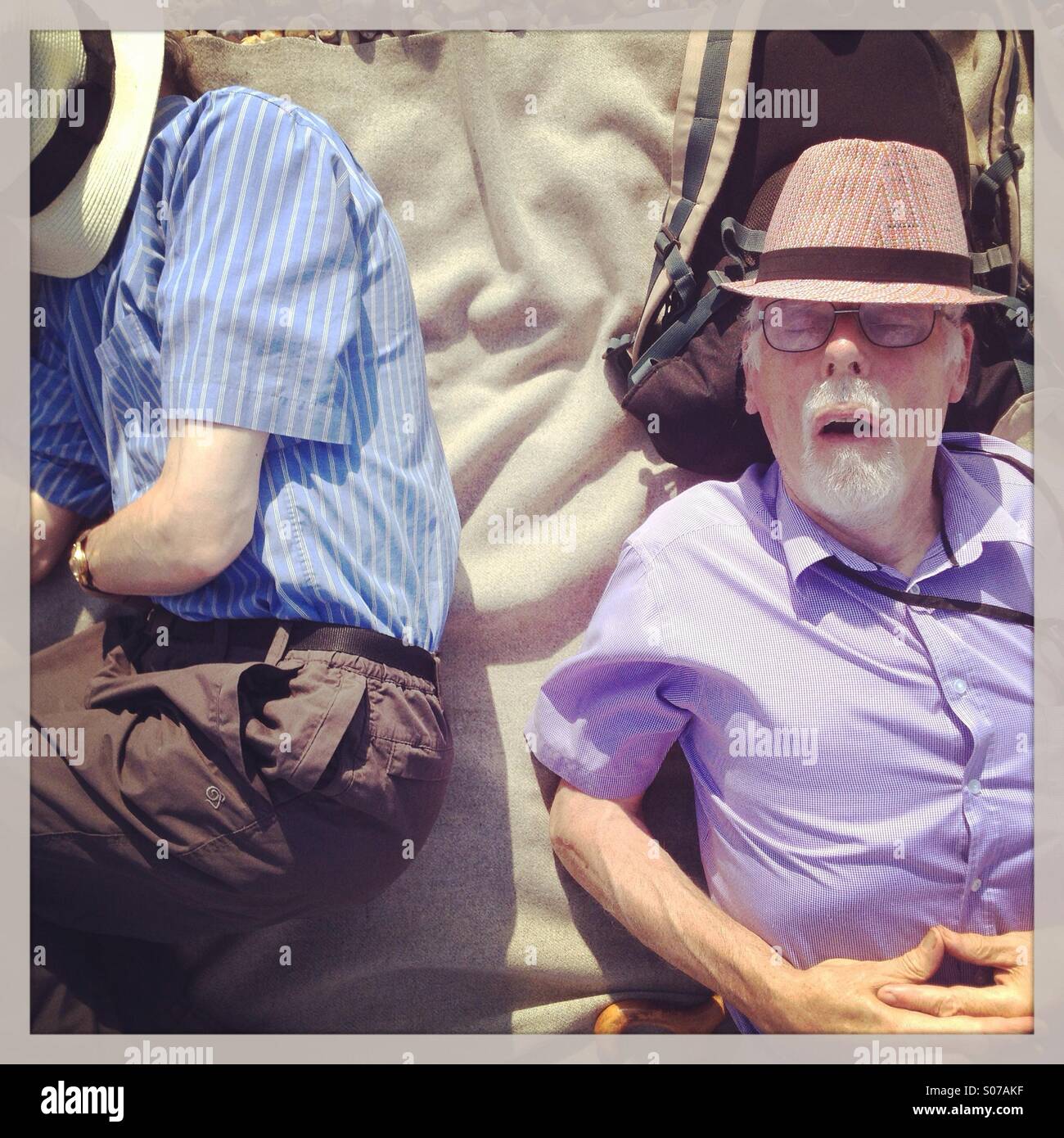 Men asleep on the beach - Smartphone Captured Stock Image