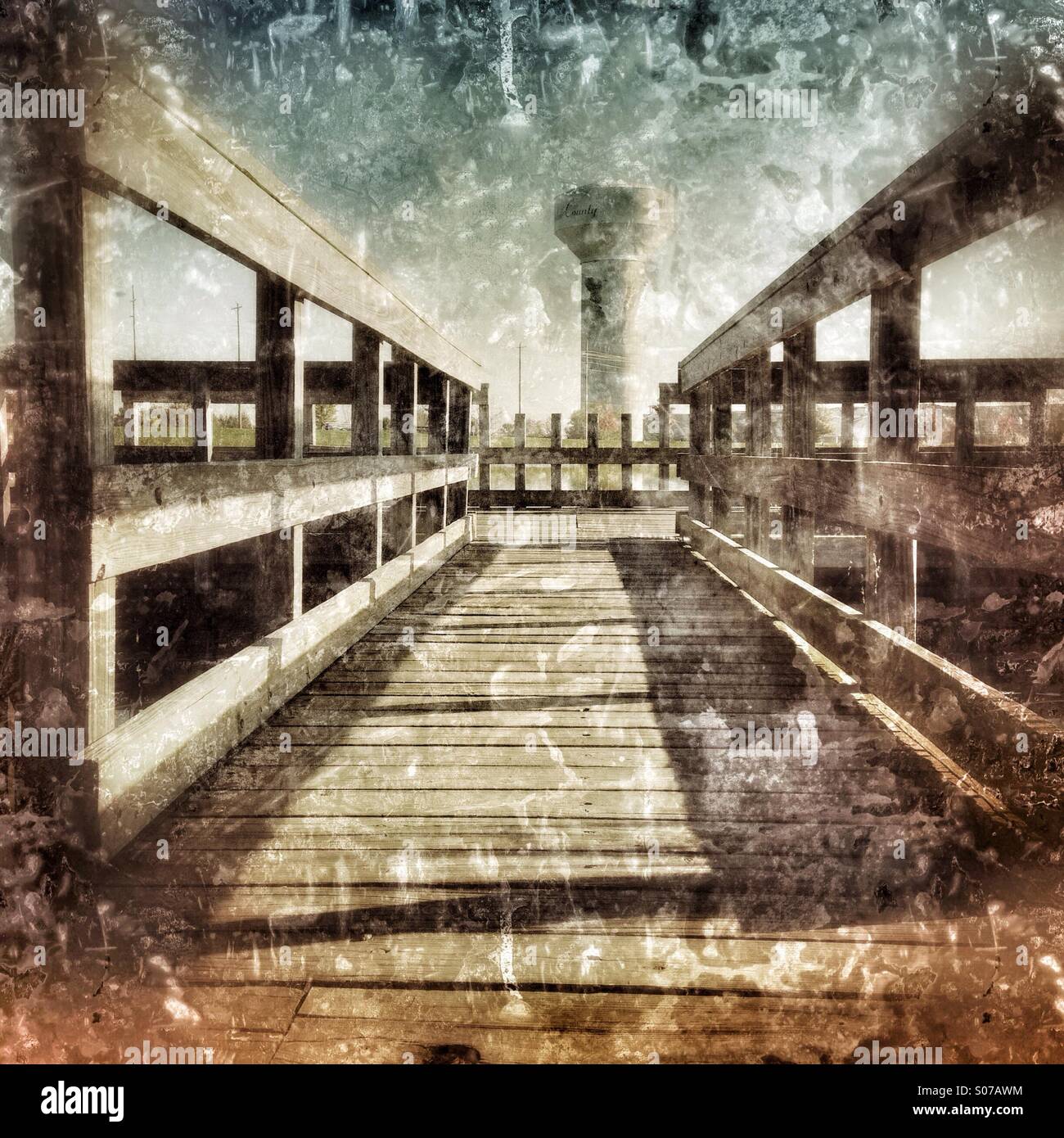 A water tower at the end of a pier. - Smartphone Captured Stock Image