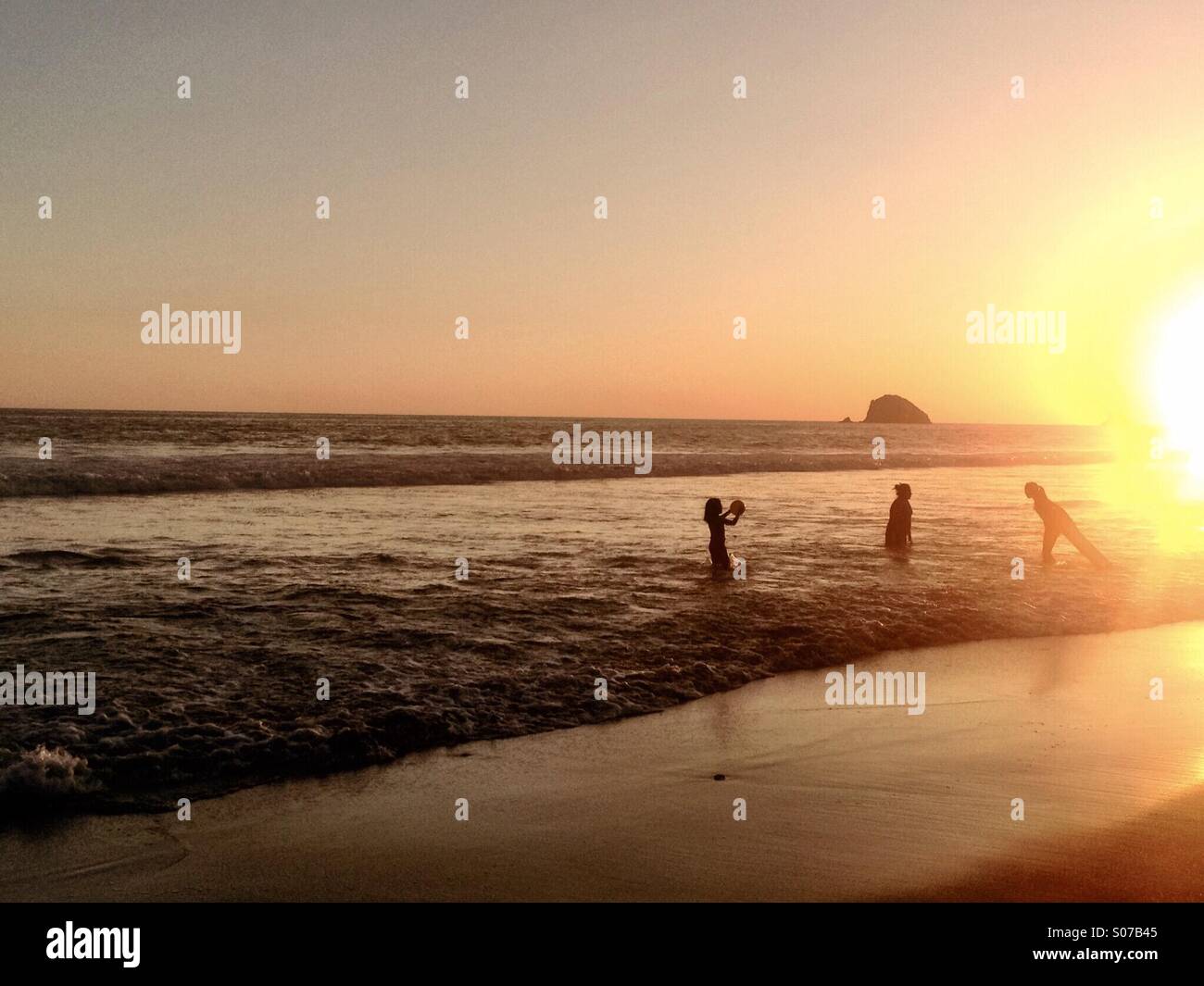 Children playing in surf, Zipolite, Oaxaca, Mexico Stock Photo Alamy