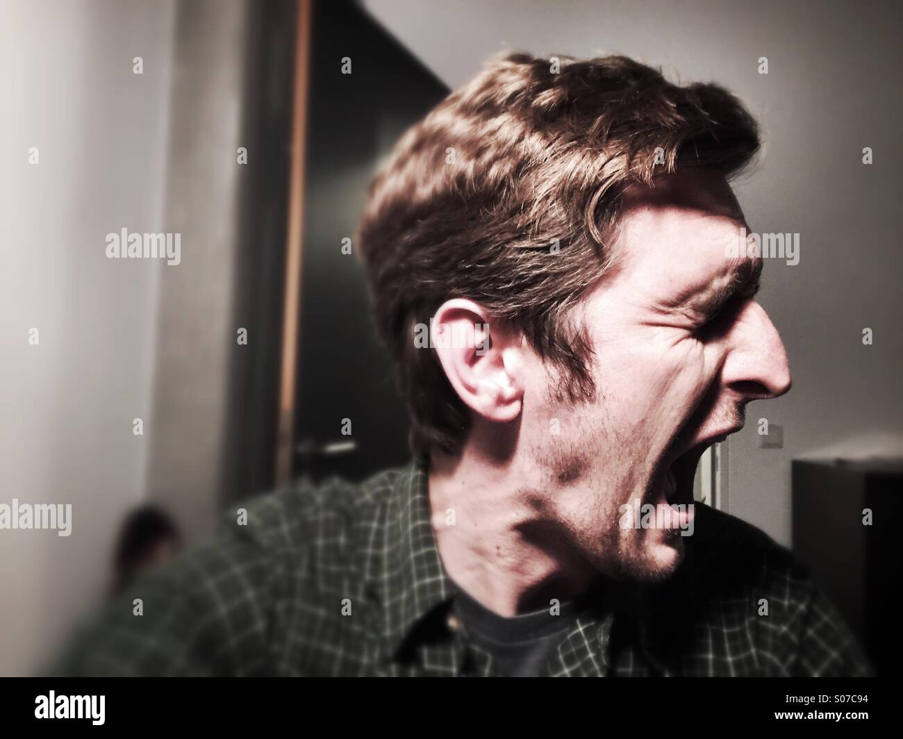 Man Screaming And Looking Terrified Stock Photo - Download Image