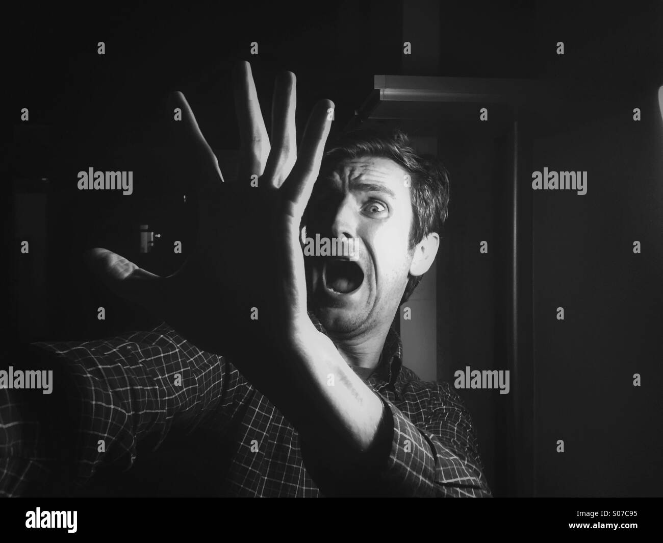 Halloween scream, man scared from something Stock Photo