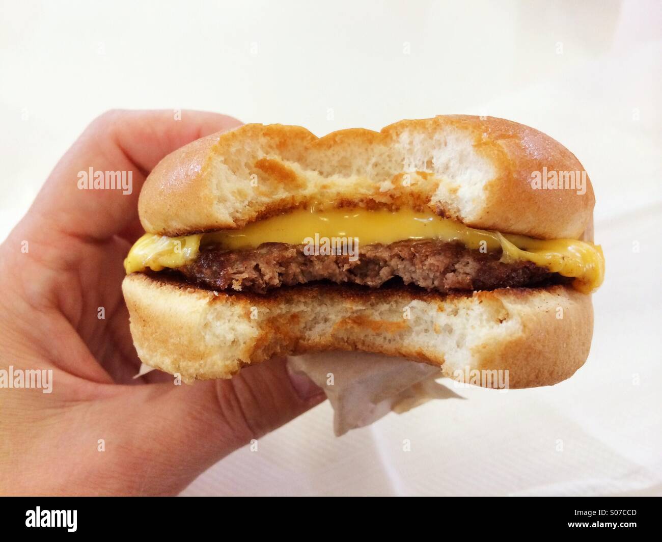 Eating a cheeseburger at In-N-Out Burger - Smartphone Captured Stock Image