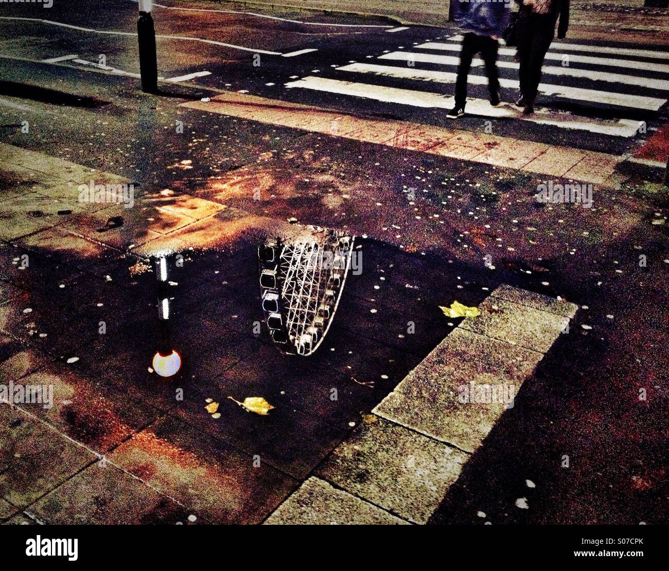Zebra crossing and reflection of Manchester Wheel - Smartphone Captured Stock Image
