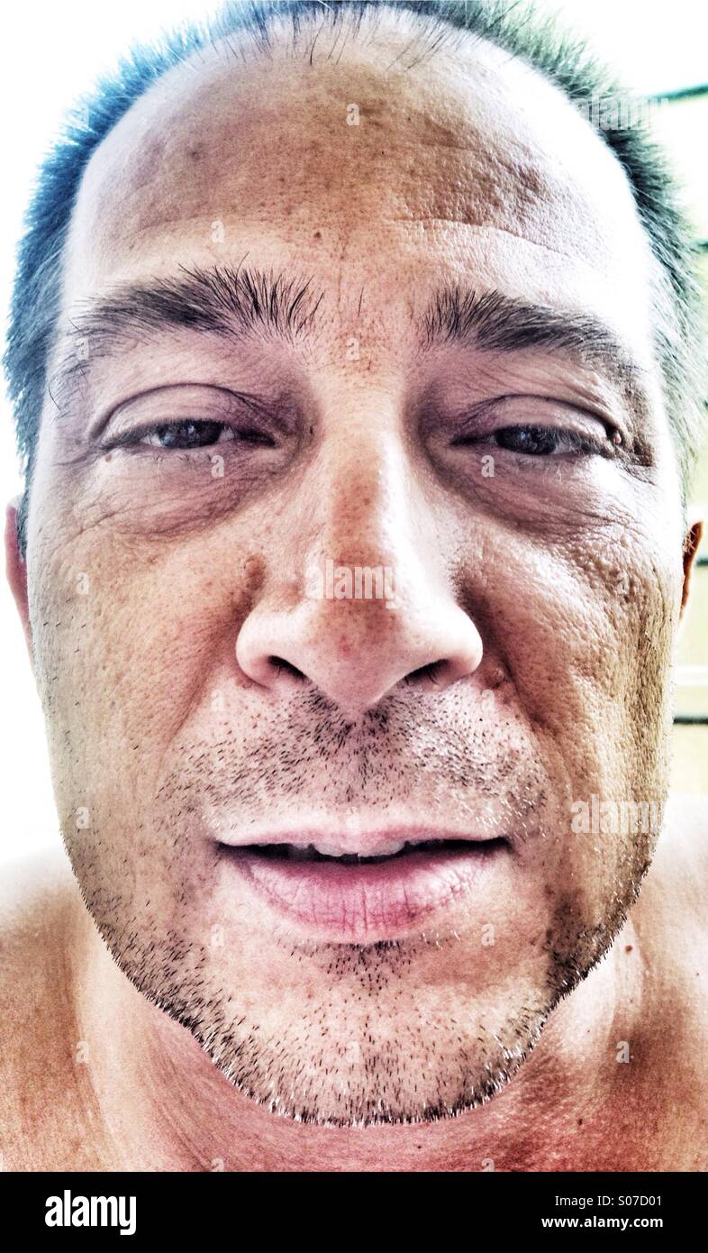 Tired fifty year old man. - Smartphone Captured Stock Image