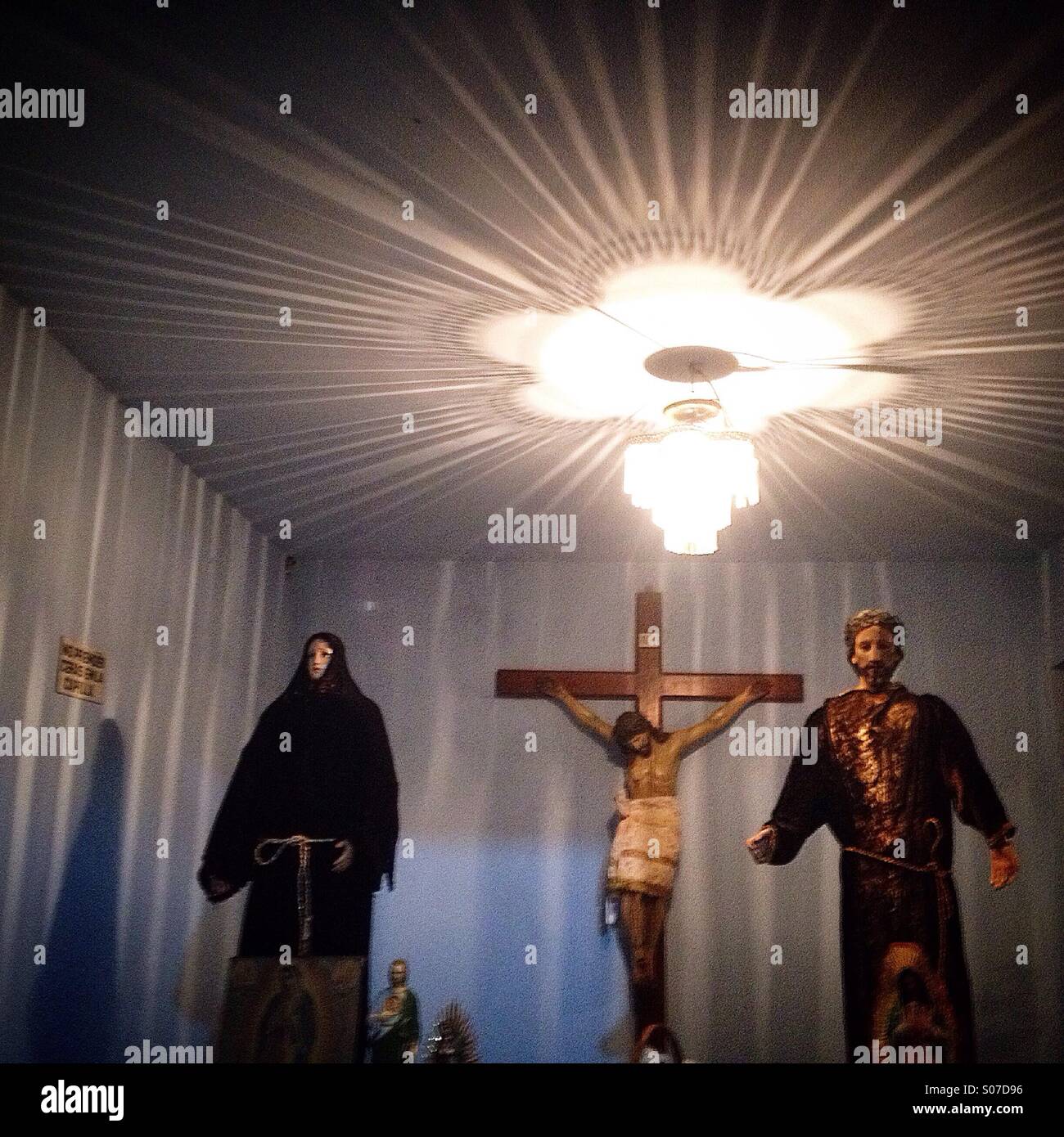 A lamp illuminates the chapel of San Gregorio Atlapulco cemetery during Day of the Dead in Xochimilco, Mexico City,Mexico - Smartphone Captured Stock Image