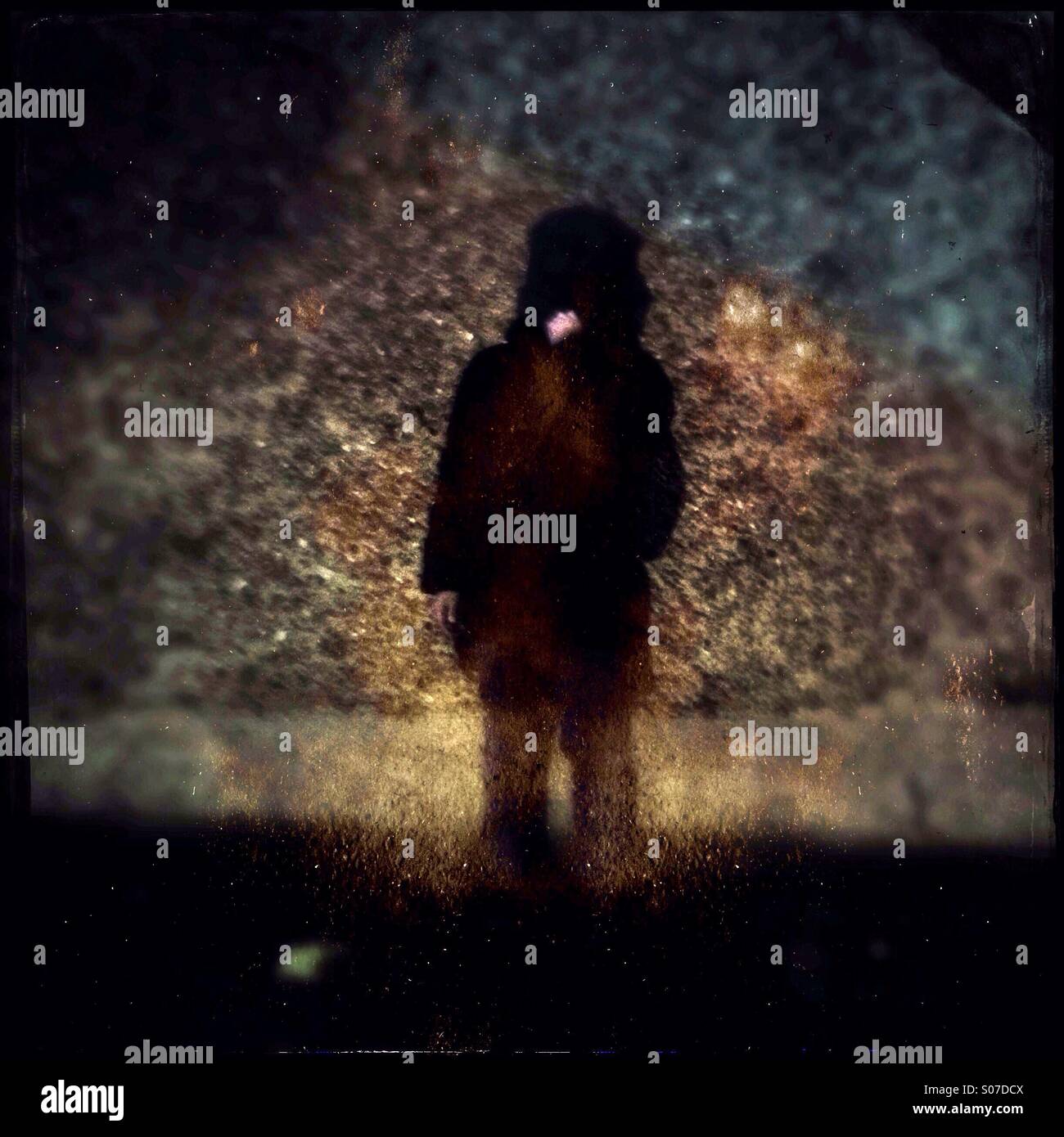 Abstracts image of a kid standing by the wall - Smartphone Captured Stock Image