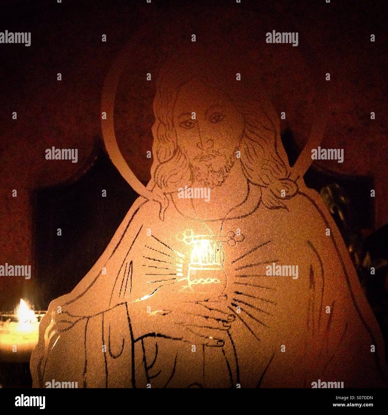 An image of the Sacred Heart of Jesus decorates a tomb in San Gregorio Atlapulco cemetery in Xochimilco, Mexico City, Mexico - Smartphone Captured Stock Image