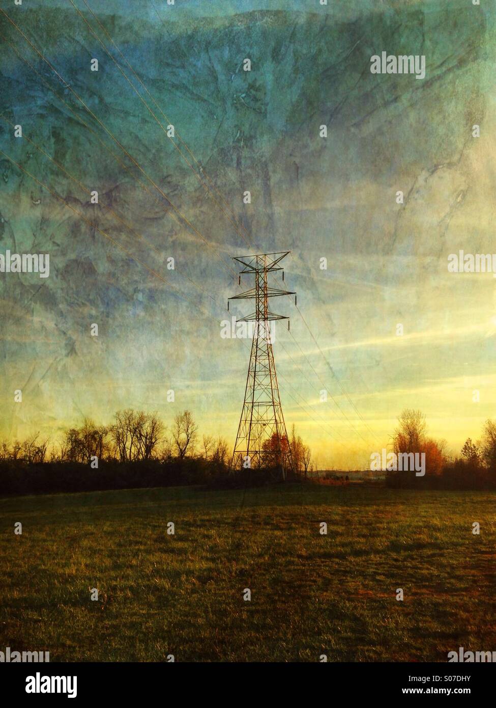 Glowing sunlight on a high voltage tower. - Smartphone Captured Stock Image