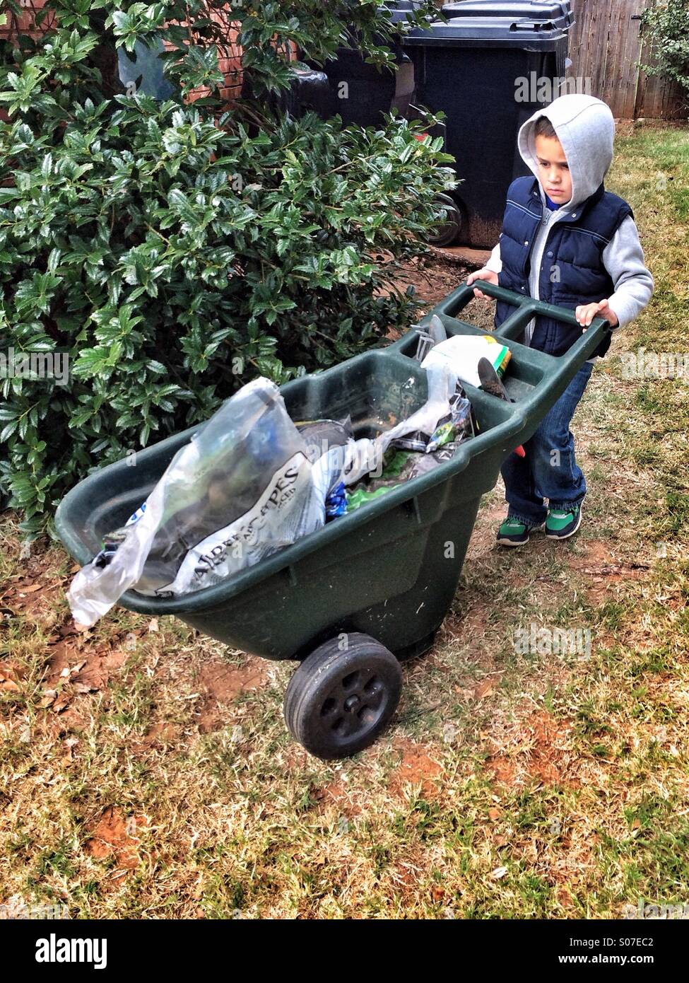 Boy with a wheelbarrow hi-res stock photography and images - Alamy
