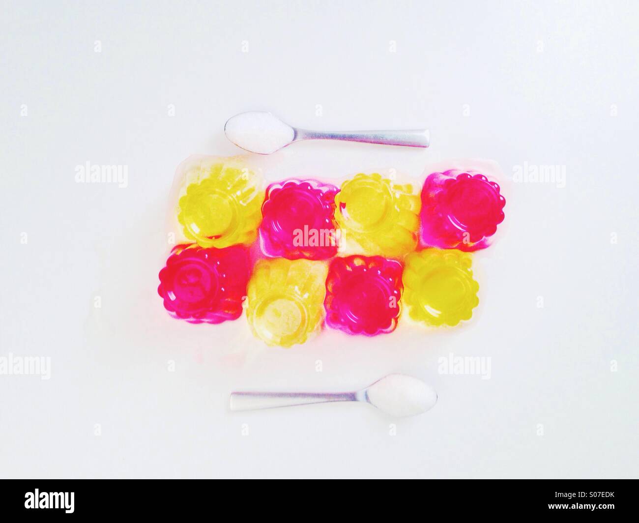 Lemon and strawberry jelly on a white table. Stock Photo
