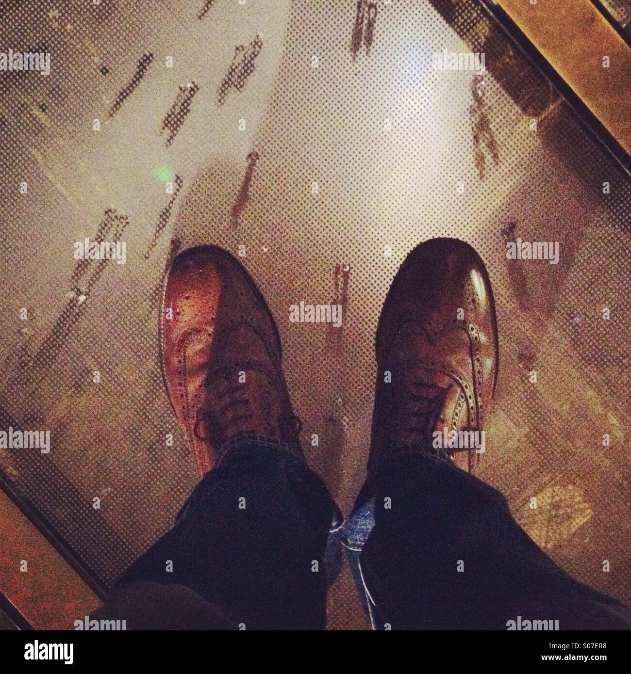 Watching the tourists from the Eiffel Tower glass floor - Smartphone Captured Stock Image