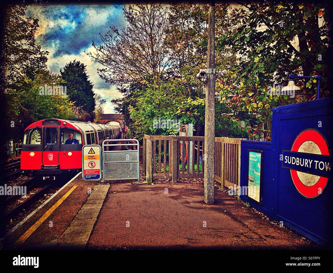 Train arriving at Sudbury Town tube station, London Borough of Brent, England, UK Stock Photo