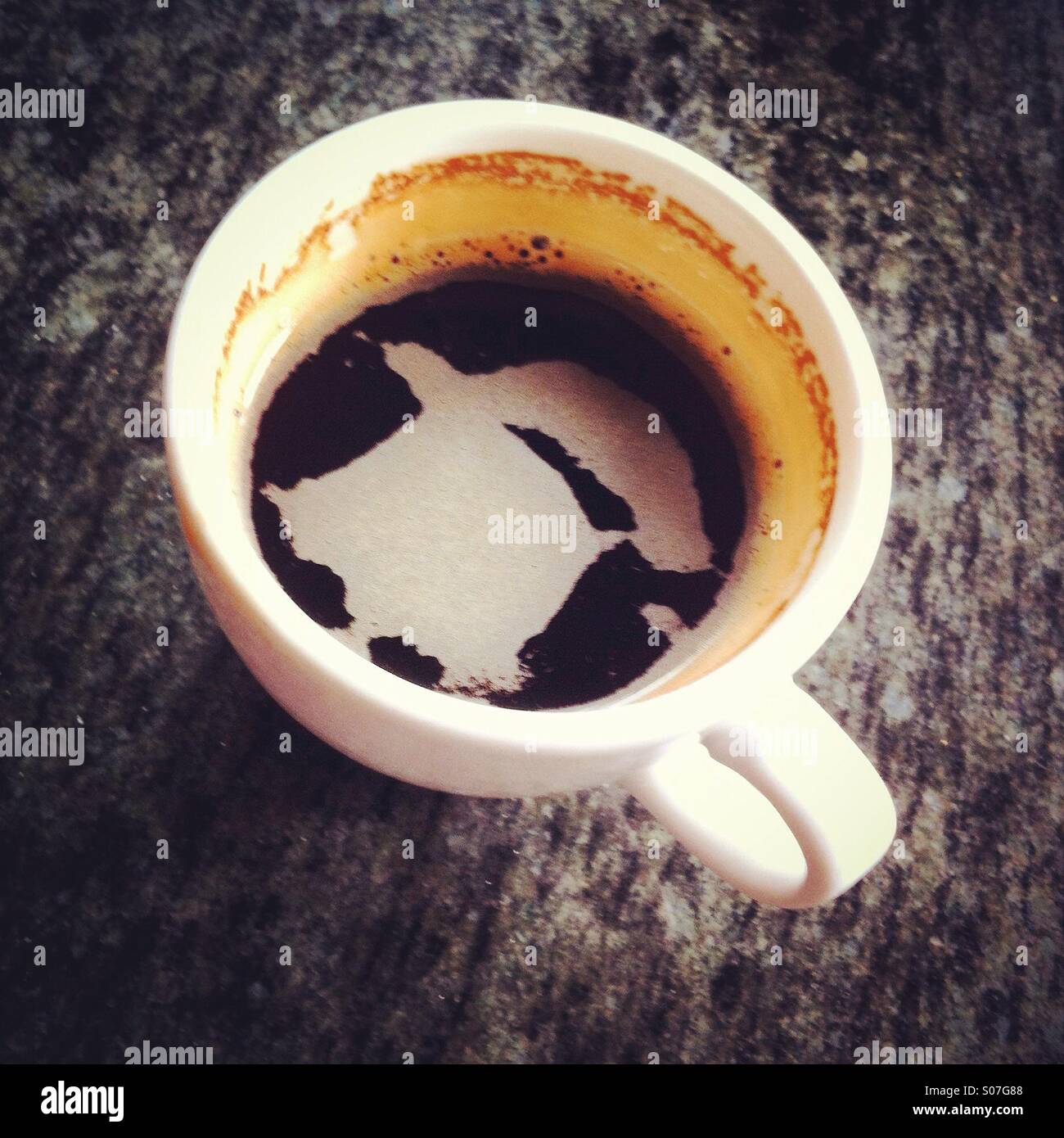 Shape in the foam of a cup of coffee - Smartphone Captured Stock Image