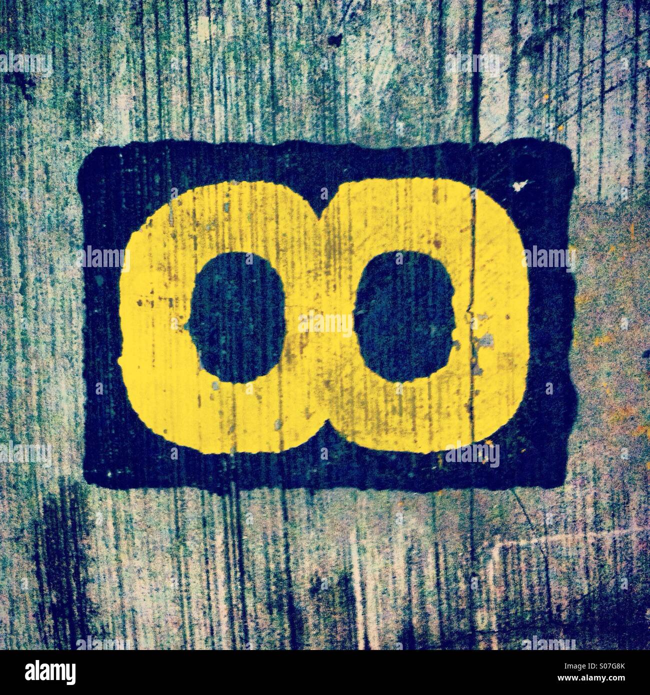 Yellow eyes or glasses painted on the floor - Smartphone Captured Stock Image