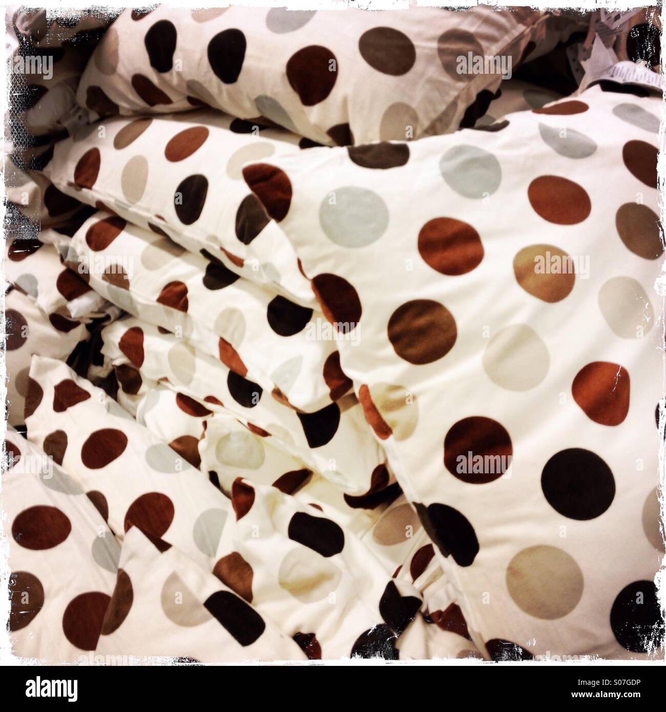 A pile of spotted cushions Stock Photo