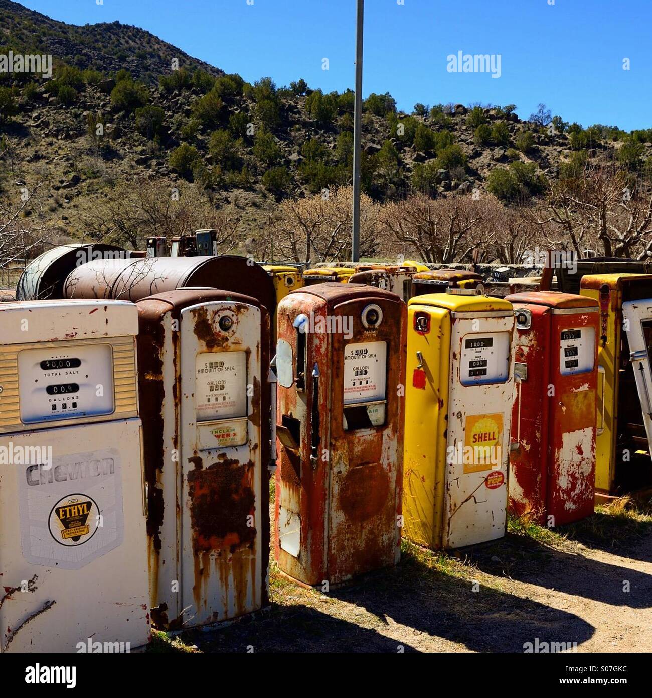 Old gas pumps lined up for sale on the side of a highway in New Mexico  Stock Photo - Alamy