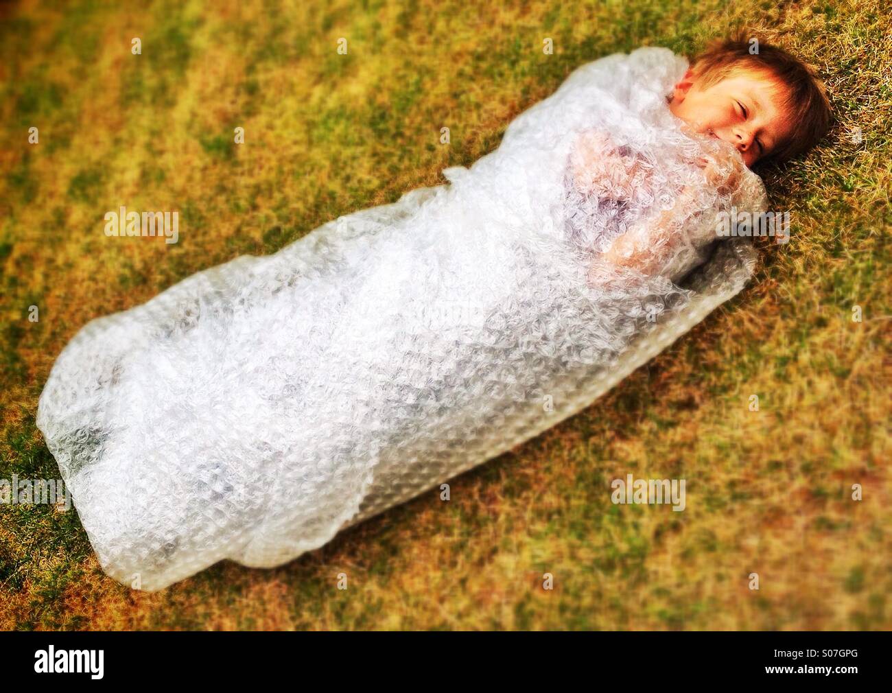 Bubble wrap boy Stock Photo Alamy